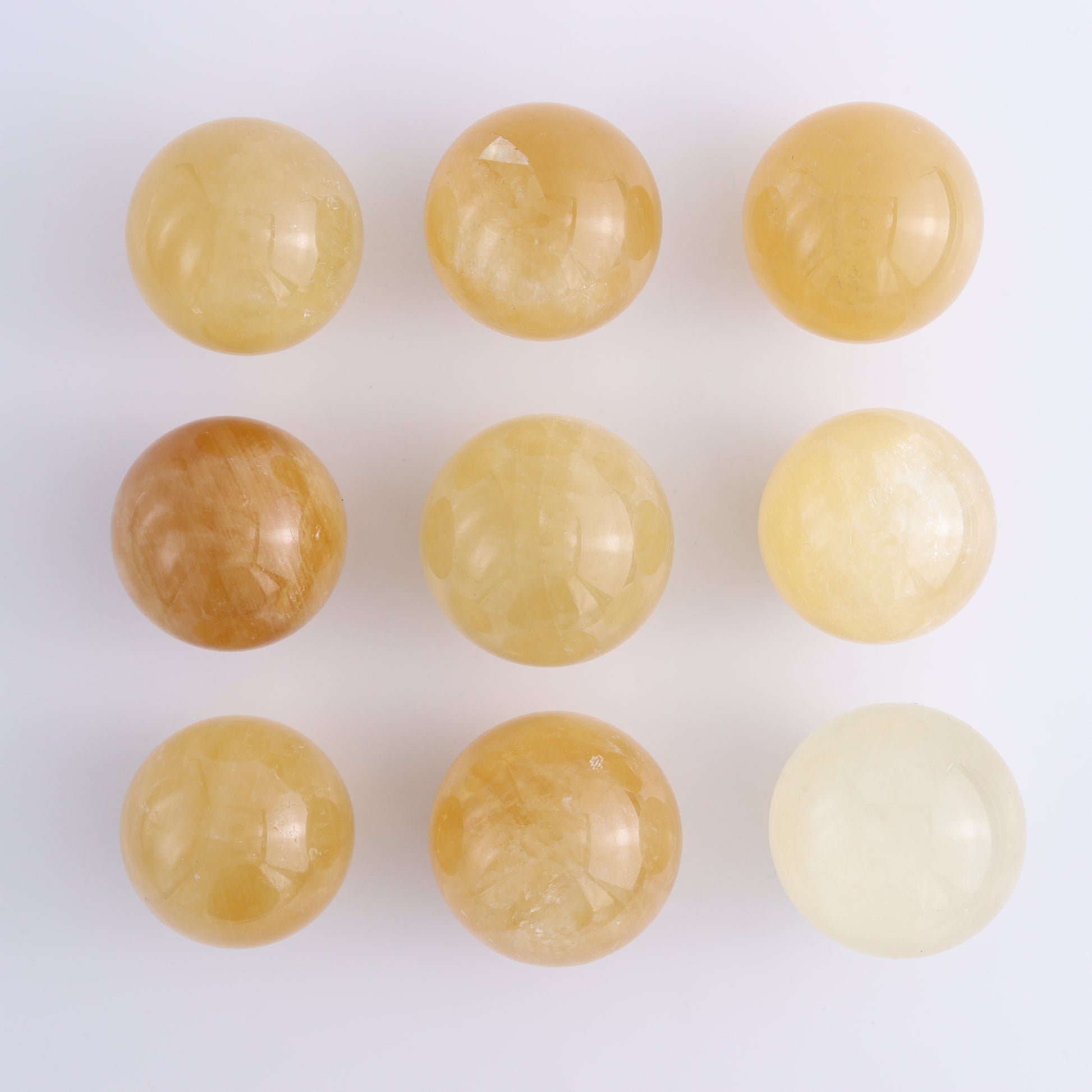 Calcite Spheres Set of 9 - Expert Wholesale and Supplier of Wholesale Crystals & Bulk Gemstones, ["Calcite","Mexico","Spheres"]