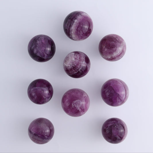 Purple Fluorite Spheres Set of 9 - Expert Wholesale and Supplier of Wholesale Crystals & Bulk Gemstones, ["Fluorite","Purple Fluorite","Spheres"]