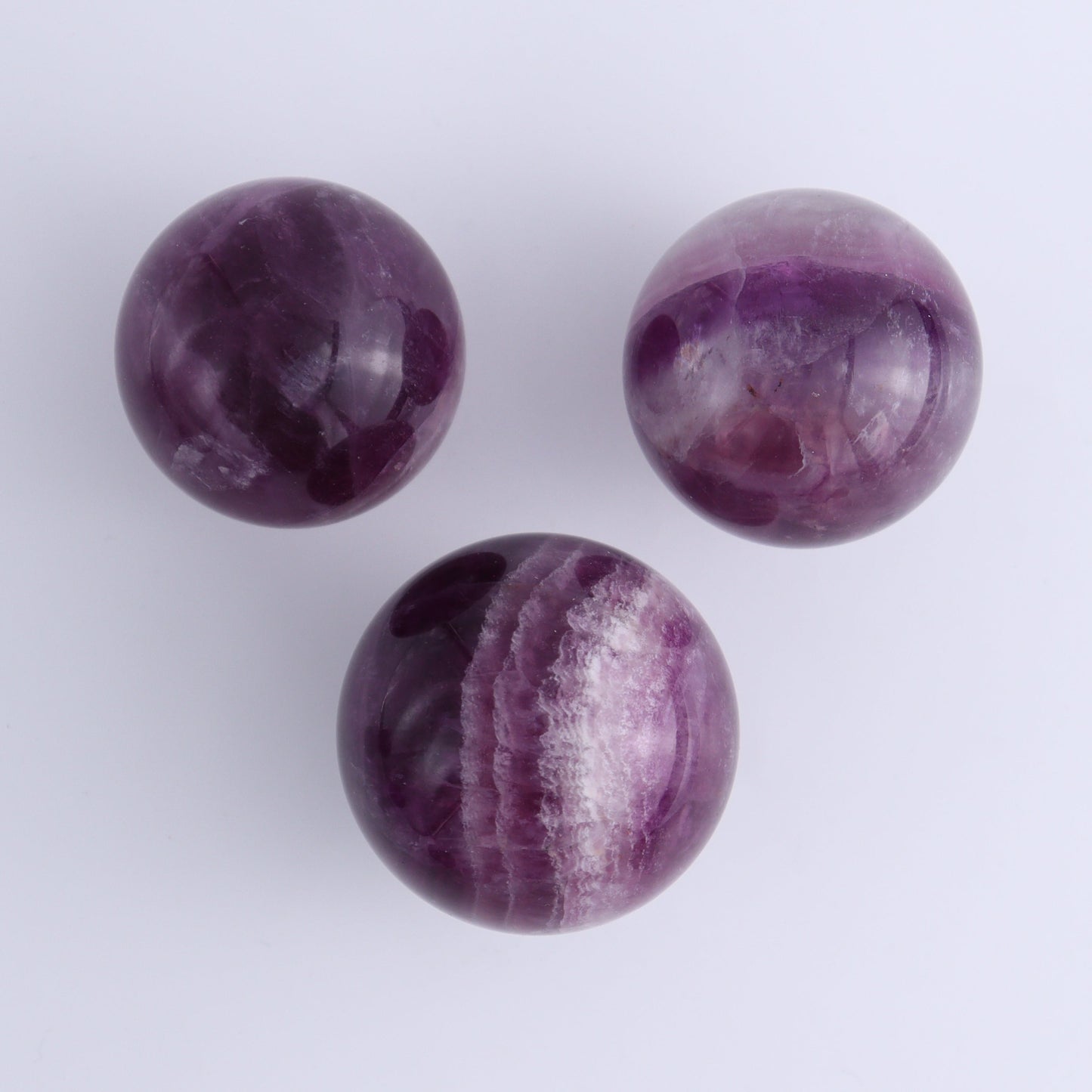 Purple Fluorite Spheres Set of 9 - Expert Wholesale and Supplier of Wholesale Crystals & Bulk Gemstones, ["Fluorite","Purple Fluorite","Spheres"]