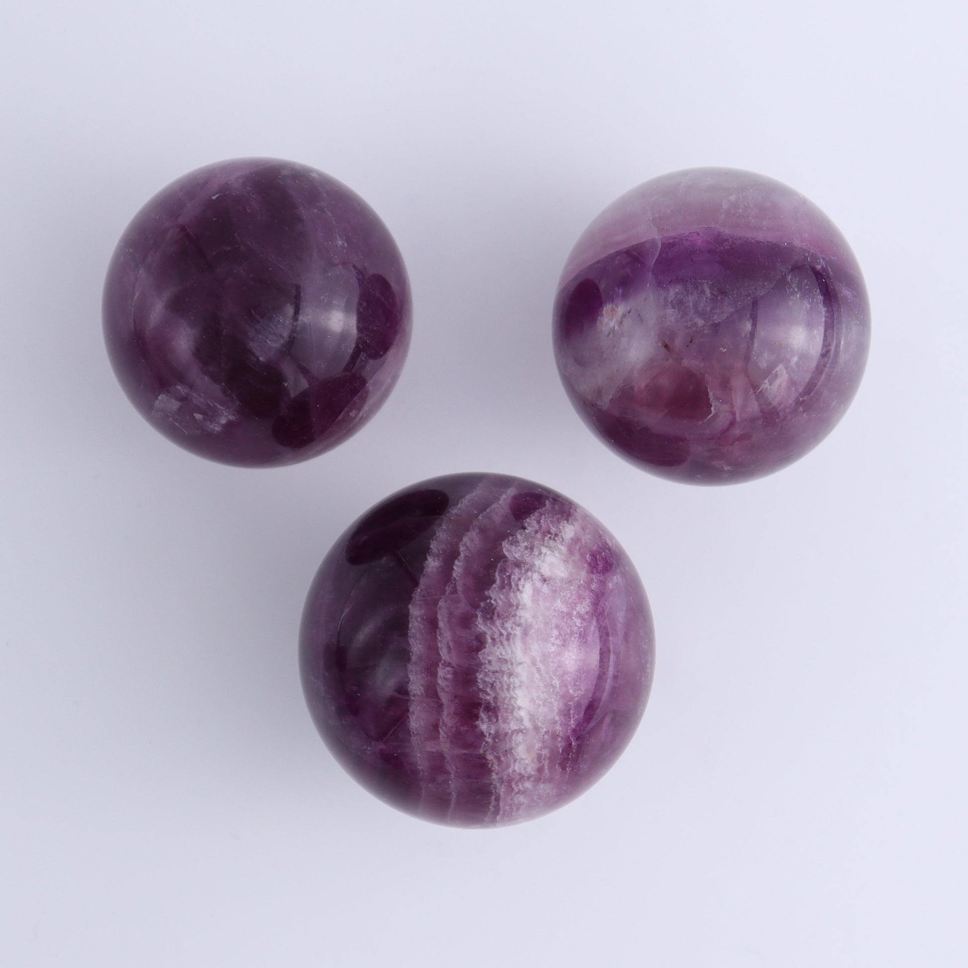 Purple Fluorite Spheres Set of 9 - Expert Wholesale and Supplier of Wholesale Crystals & Bulk Gemstones, ["Fluorite","Purple Fluorite","Spheres"]