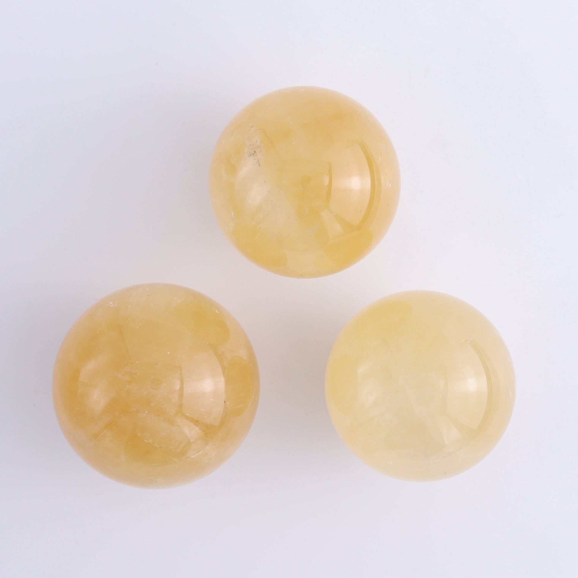 Calcite Spheres Set of 9 - Expert Wholesale and Supplier of Wholesale Crystals & Bulk Gemstones, ["Calcite","Mexico","Spheres"]