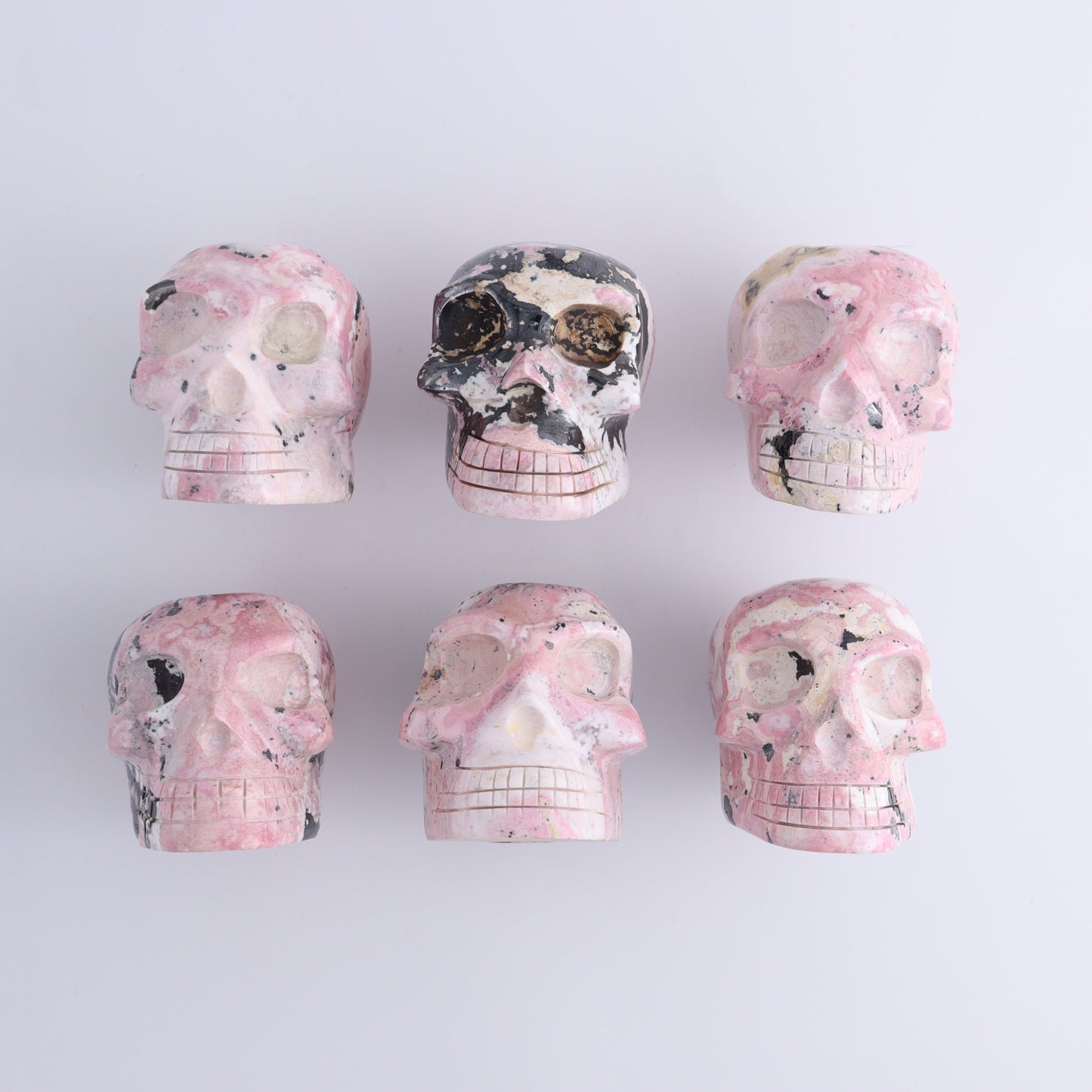 Rhodonite Skulls Set of 6 - Expert Wholesale and Supplier of Wholesale Crystals & Bulk Gemstones, ["Peru","Rhodonite","Skulls"]