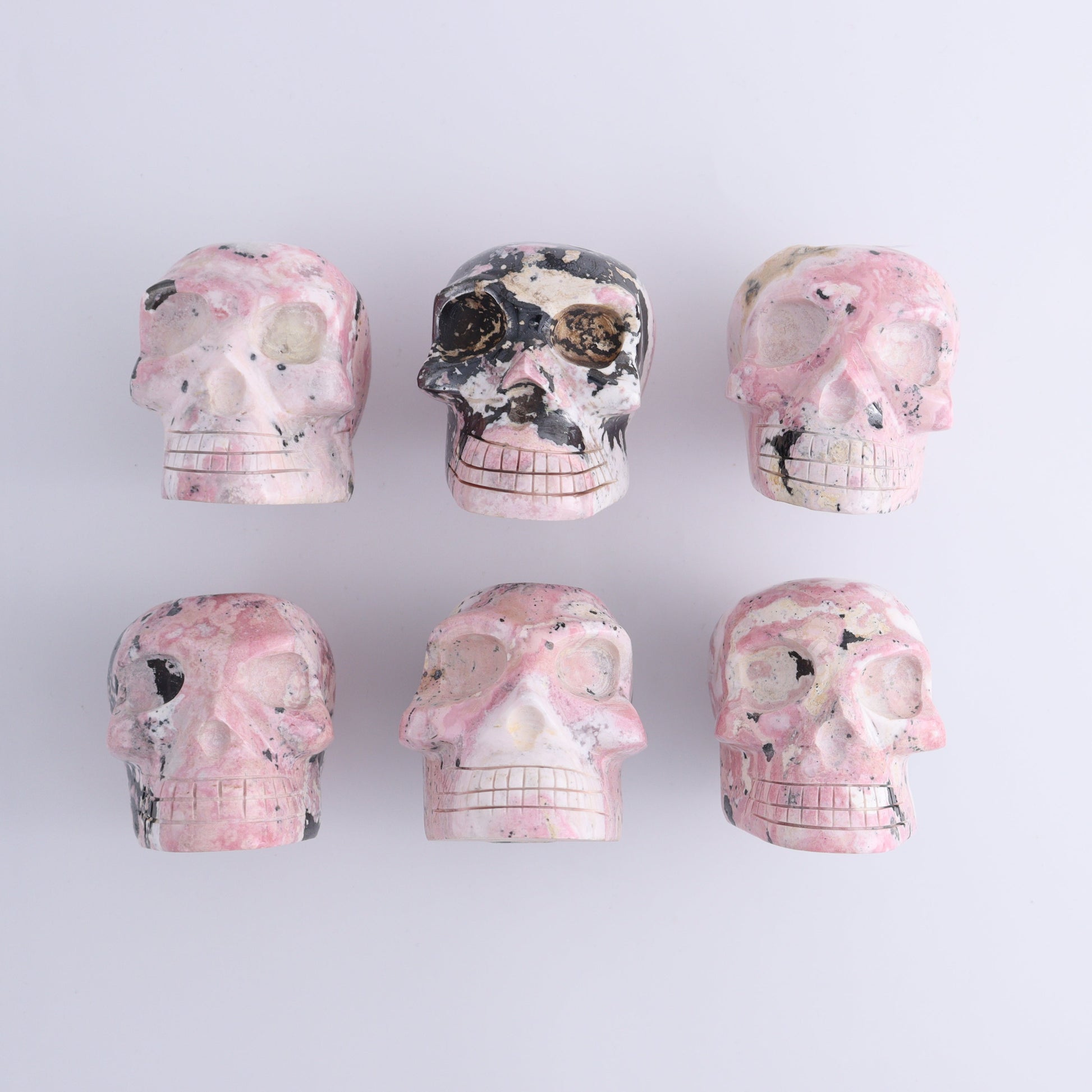 Rhodonite Skulls Set of 6 - Expert Wholesale and Supplier of Wholesale Crystals & Bulk Gemstones, ["Peru","Rhodonite","Skulls"]