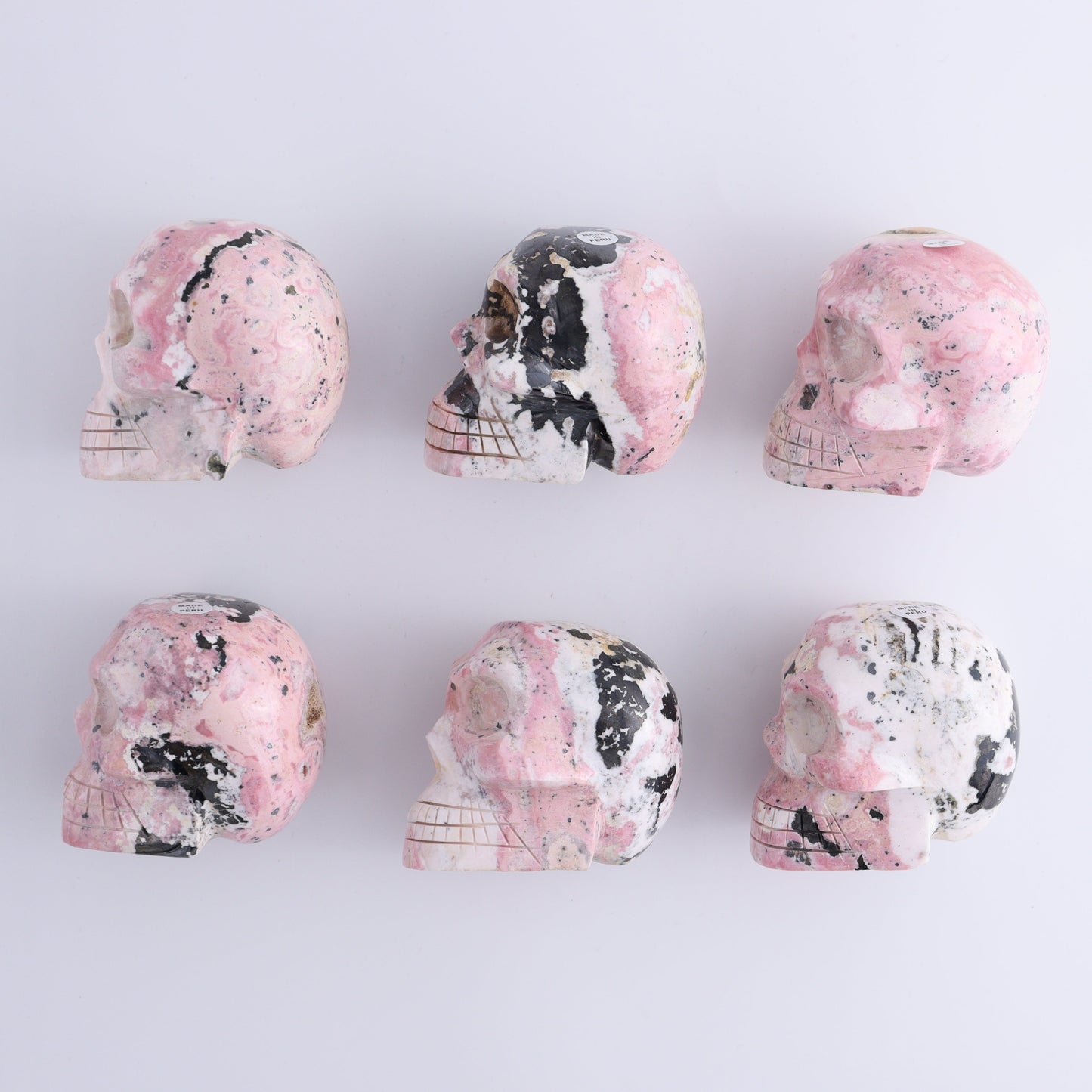 Rhodonite Skulls Set of 6 - Expert Wholesale and Supplier of Wholesale Crystals & Bulk Gemstones, ["Peru","Rhodonite","Skulls"]