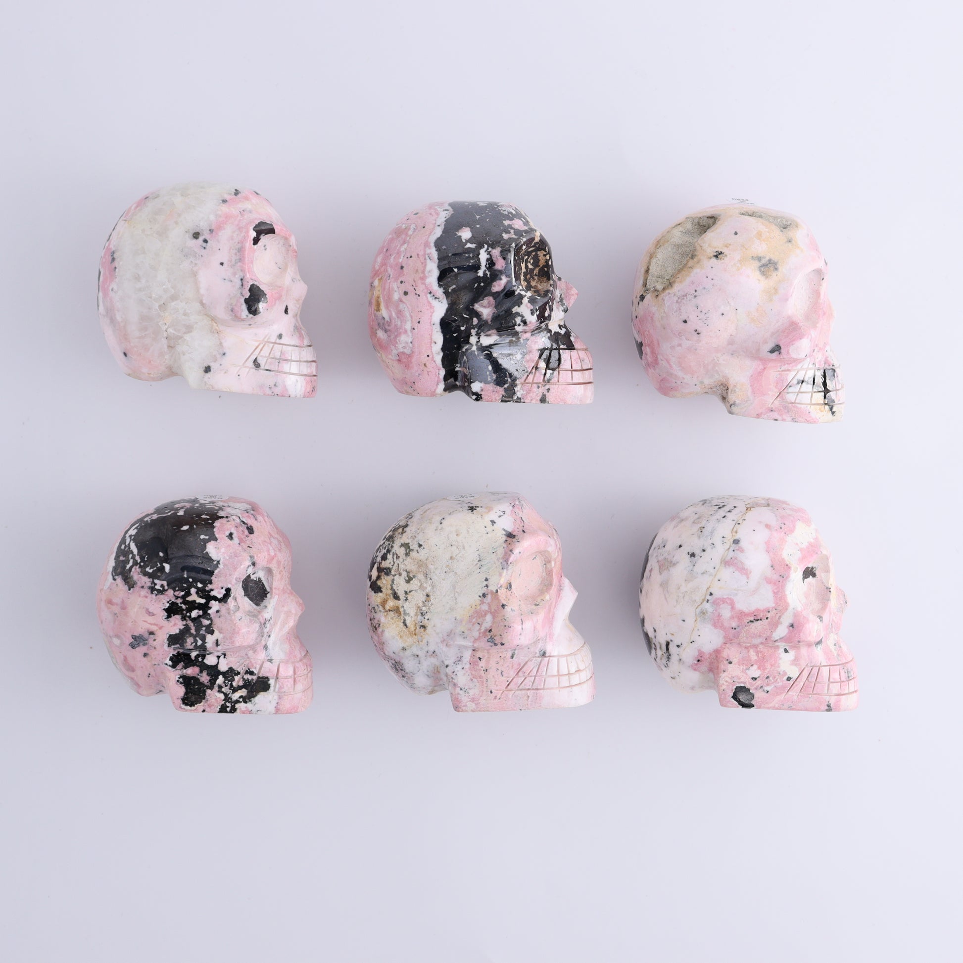 Rhodonite Skulls Set of 6 - Expert Wholesale and Supplier of Wholesale Crystals & Bulk Gemstones, ["Peru","Rhodonite","Skulls"]