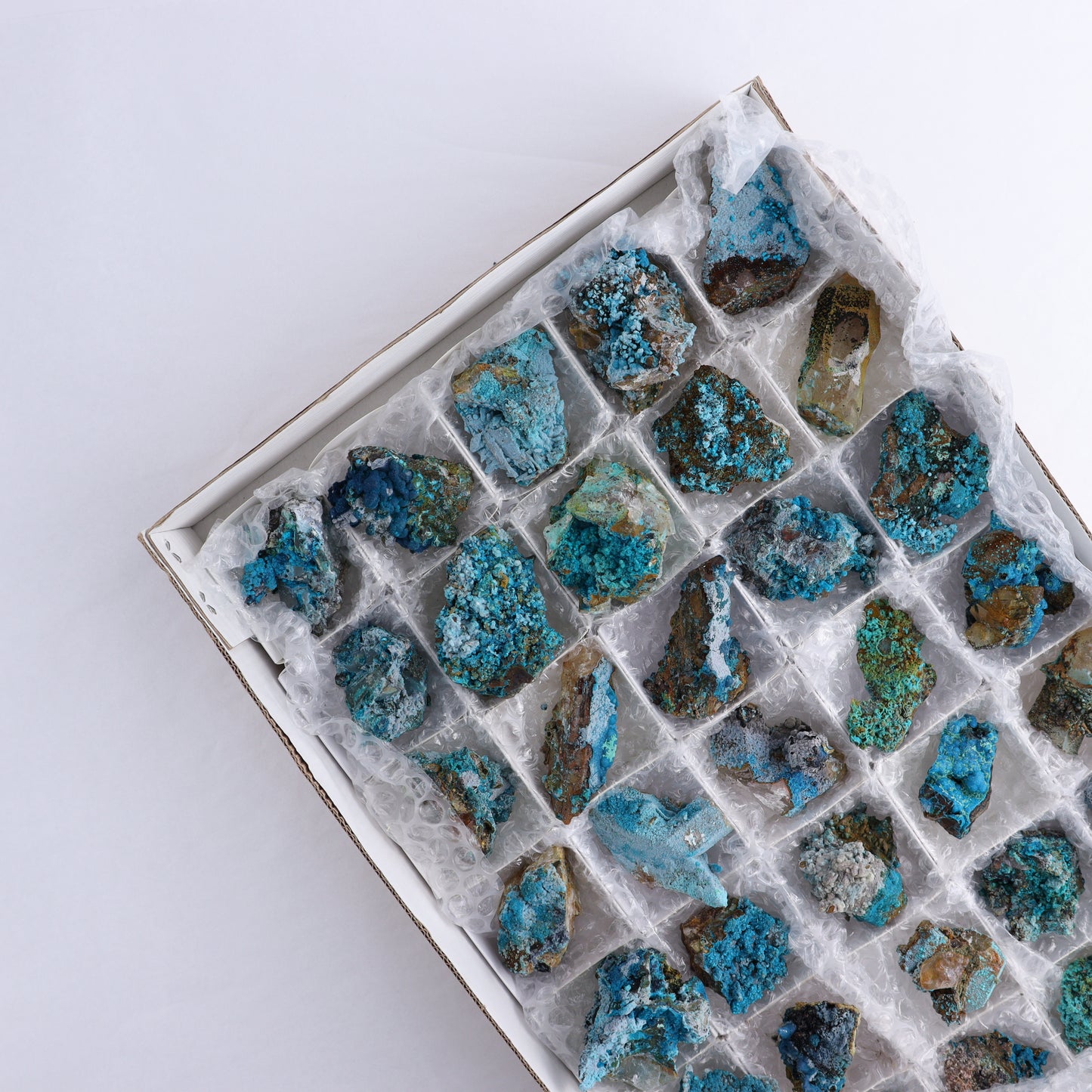 Chrysocolla on Quartz Roughs Set of 35 - Expert Wholesale and Supplier of Wholesale Crystals & Bulk Gemstones, ["Chrysocolla","Flats","Freeforms","Peru","Quartz","Rough"]