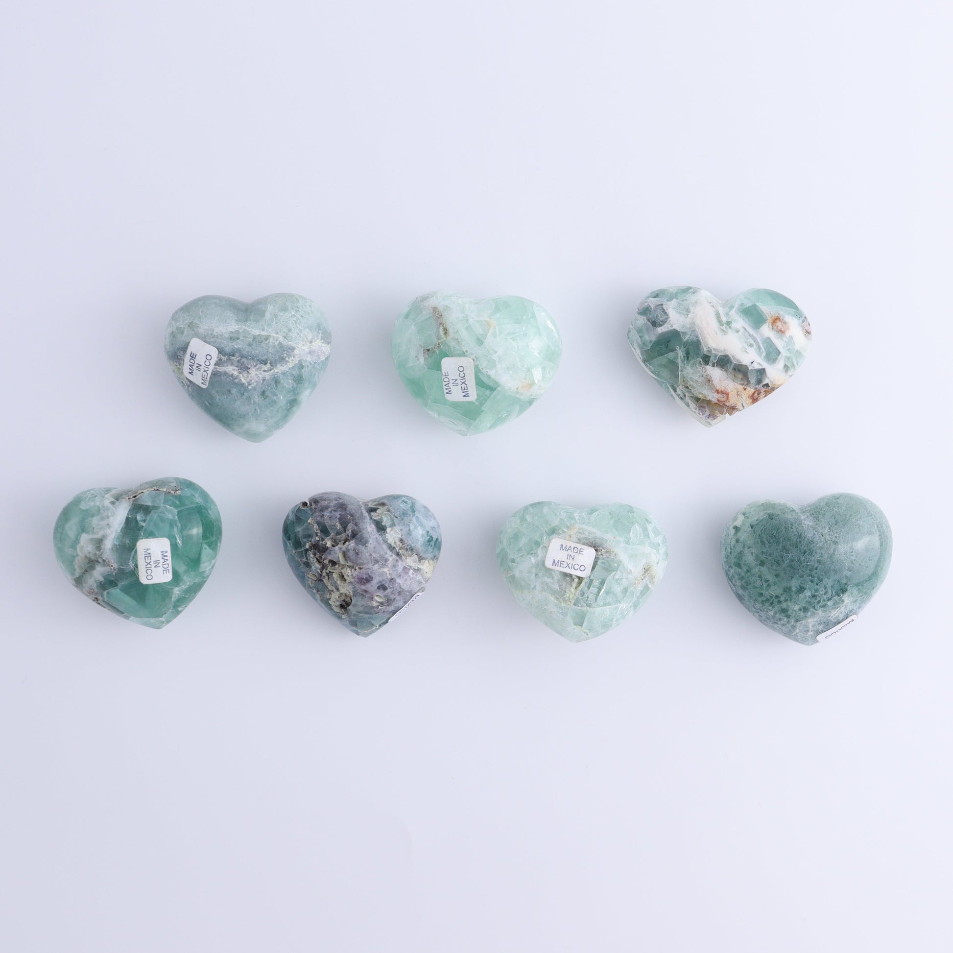 Fluorite Hearts Set of 7 - Expert Wholesale and Supplier of Wholesale Crystals & Bulk Gemstones, ["Fluorite","Hearts","Mexico"]