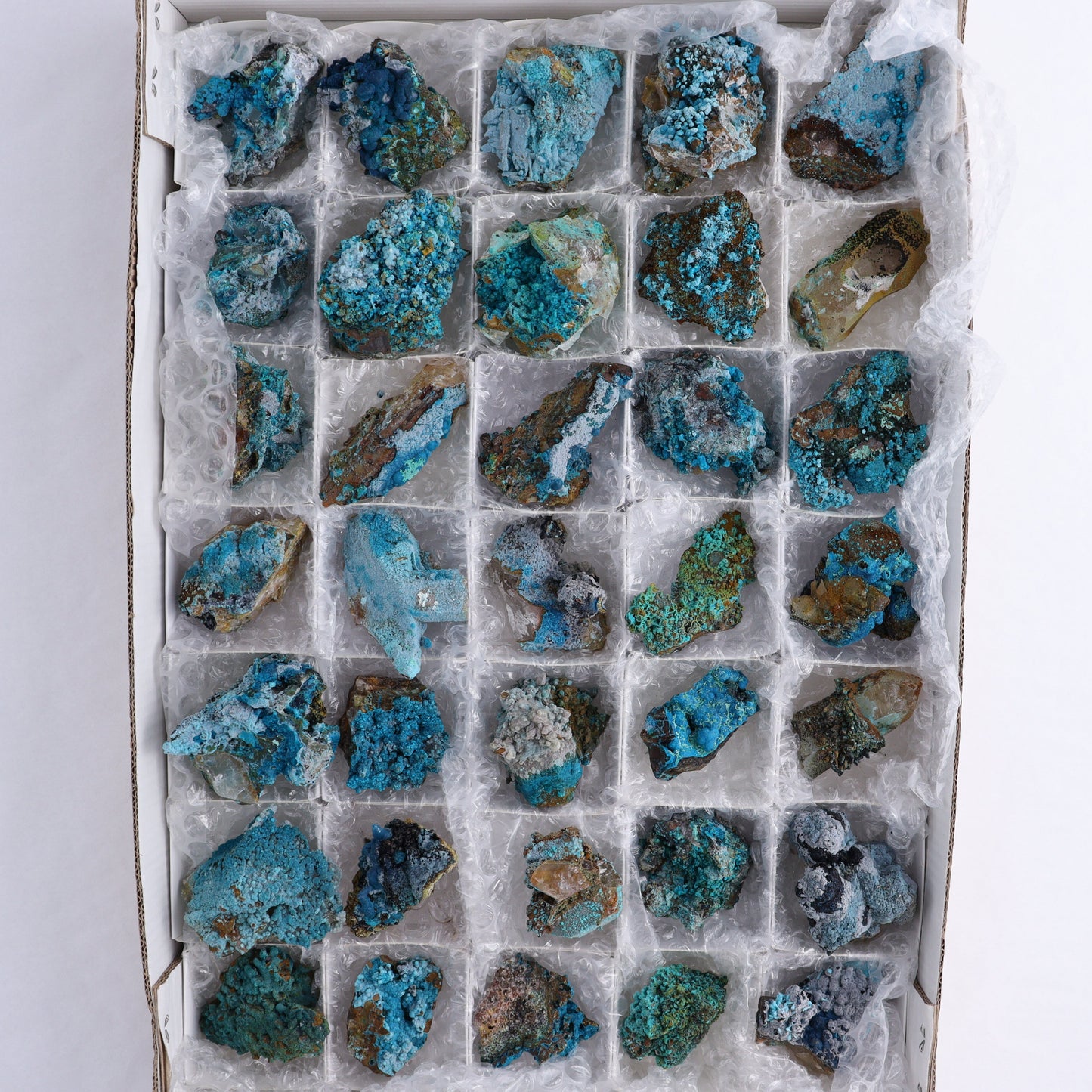 Chrysocolla on Quartz Roughs Set of 35 - Expert Wholesale and Supplier of Wholesale Crystals & Bulk Gemstones, ["Chrysocolla","Flats","Freeforms","Peru","Quartz","Rough"]