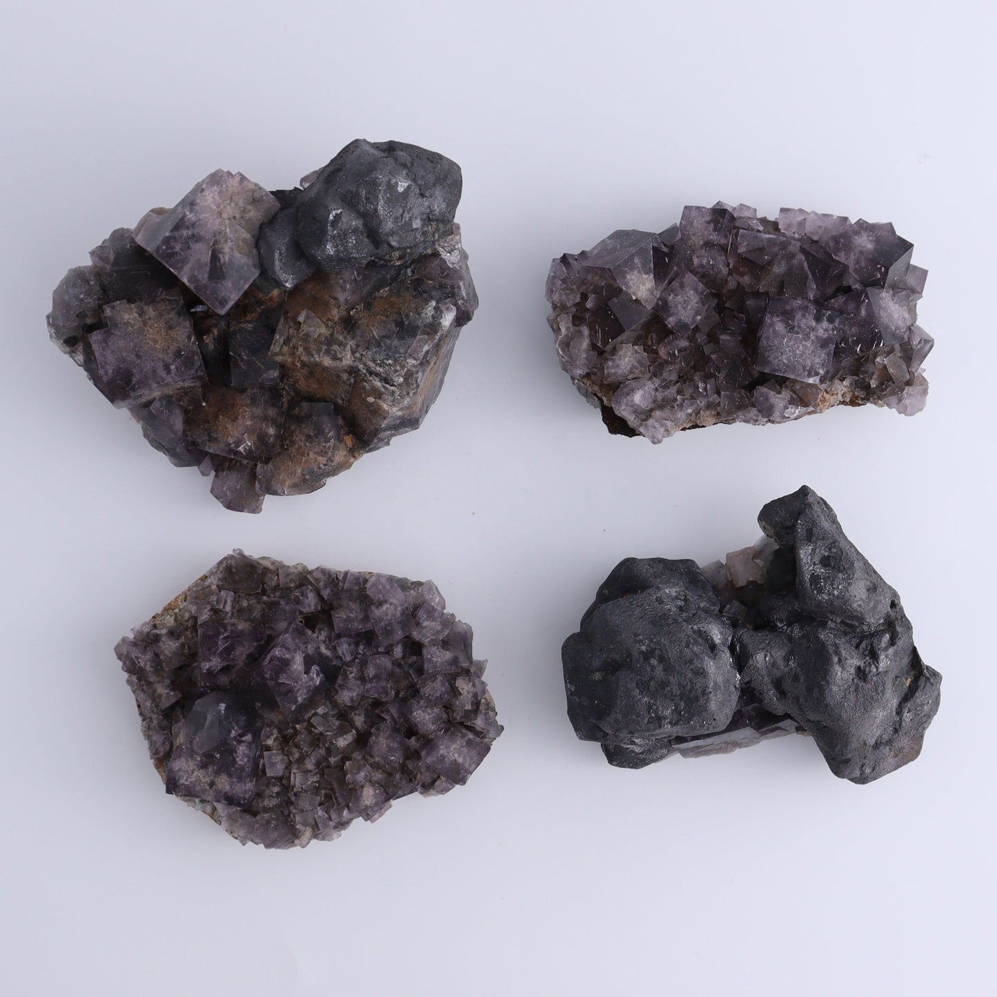 Fluorite Purple Rain Pocket Set of 8 - Expert Wholesale and Supplier of Wholesale Crystals & Bulk Gemstones, ["close_50","England","Fluorite","Purple Rain Pocket","Rough"]