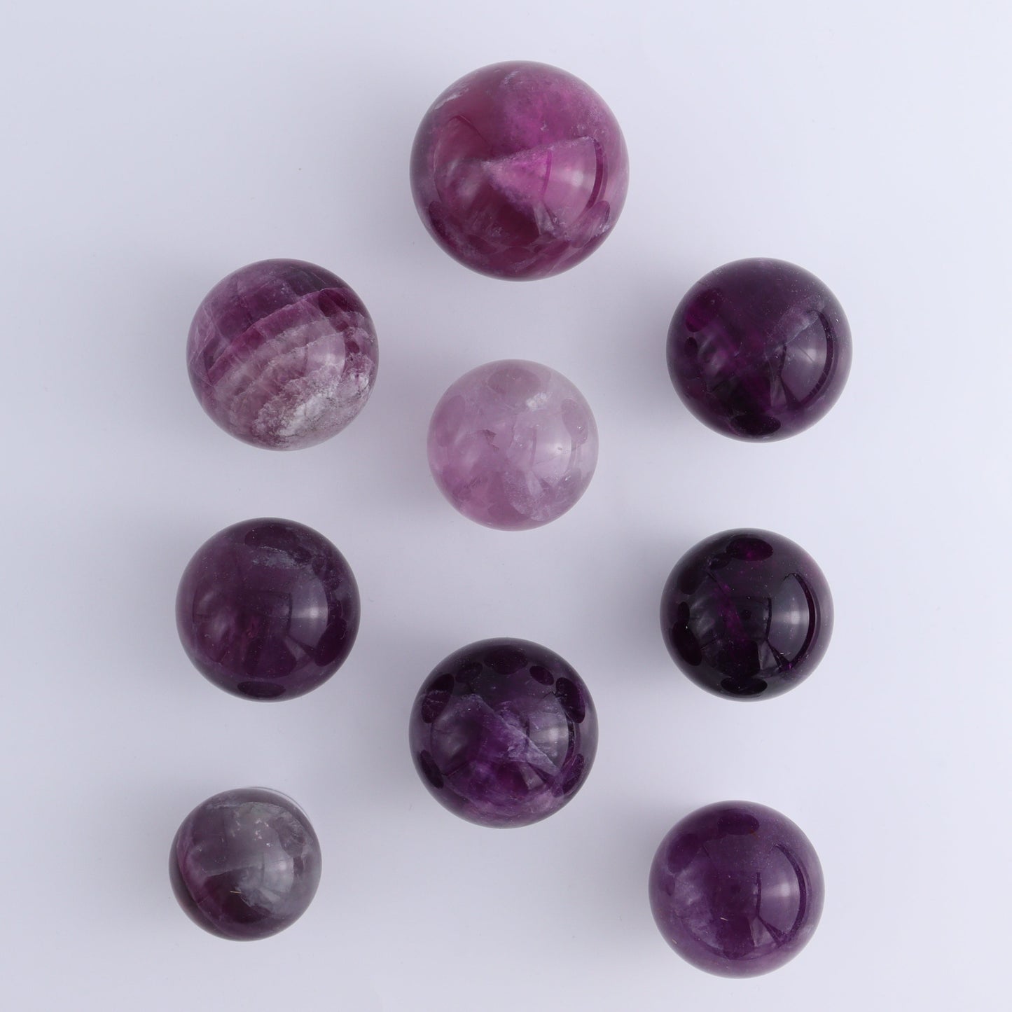 Purple Fluorite Spheres Set of 9 - Expert Wholesale and Supplier of Wholesale Crystals & Bulk Gemstones, ["Fluorite","Purple Fluorite","Spheres"]