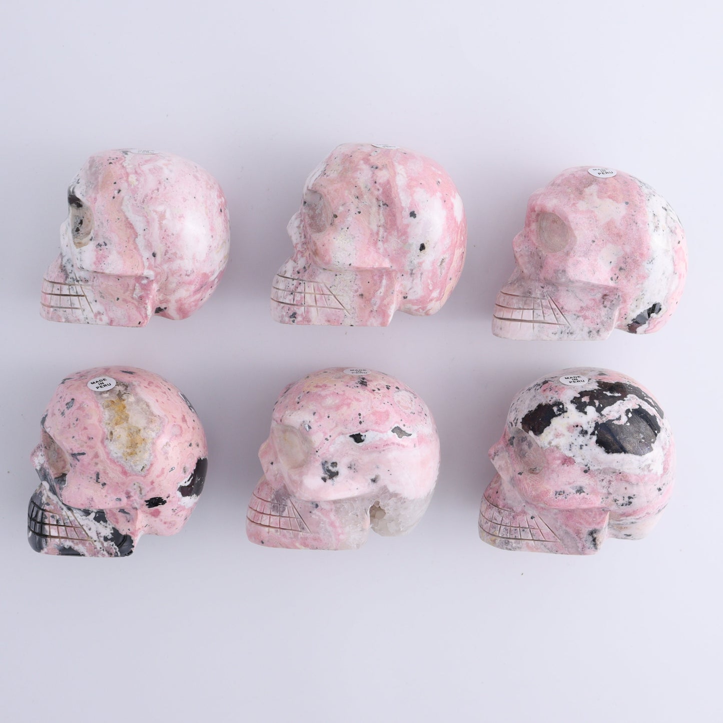 Rhodonite Skulls Set of 6 - Expert Wholesale and Supplier of Wholesale Crystals & Bulk Gemstones, ["Peru","Rhodonite","Skulls"]