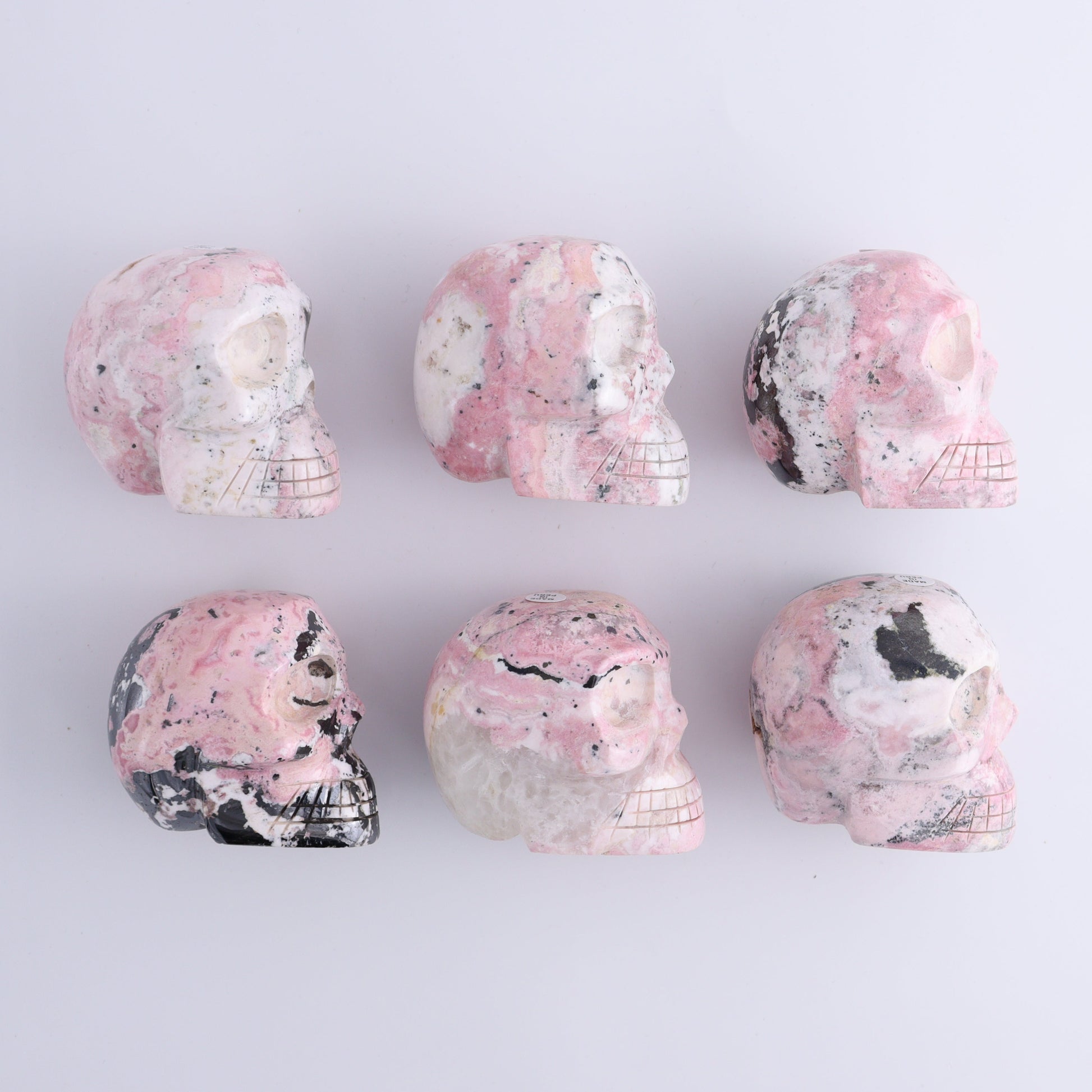 Rhodonite Skulls Set of 6 - Expert Wholesale and Supplier of Wholesale Crystals & Bulk Gemstones, ["Peru","Rhodonite","Skulls"]