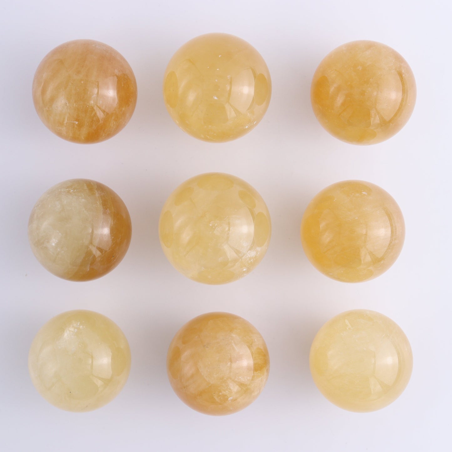 Calcite Spheres Set of 9 - Expert Wholesale and Supplier of Wholesale Crystals & Bulk Gemstones, ["Calcite","Mexico","Spheres"]