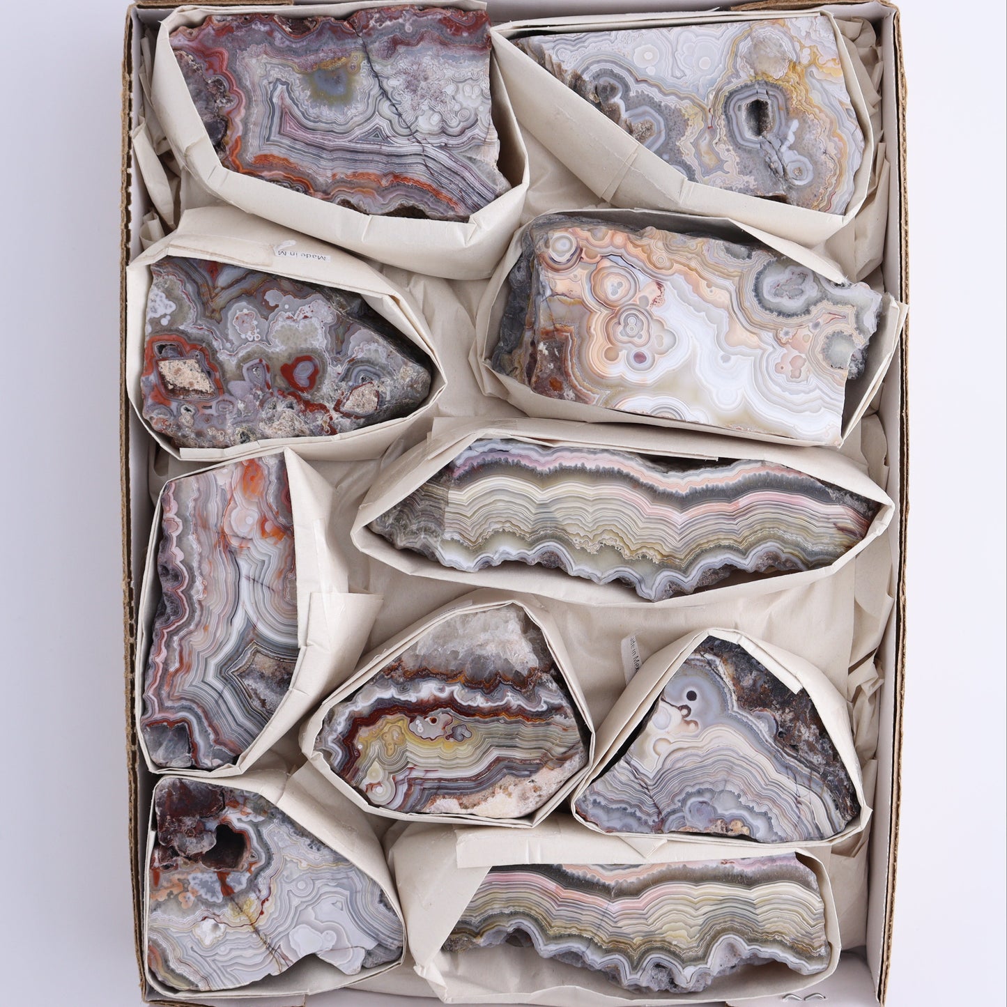 Crazy Lace Agate Flat of 10 - Expert Wholesale and Supplier of Wholesale Crystals & Bulk Gemstones, ["Crazy Lace Agate","Mexico"]