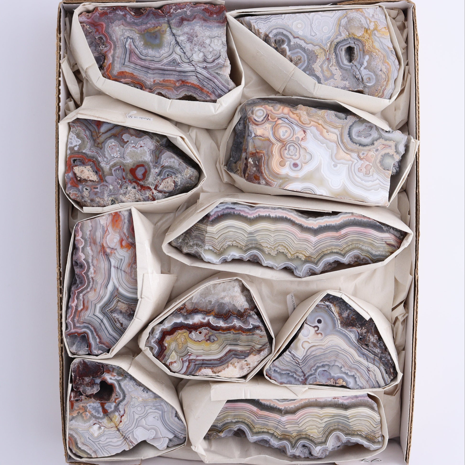 Crazy Lace Agate Flat of 10 - Expert Wholesale and Supplier of Wholesale Crystals & Bulk Gemstones, ["Crazy Lace Agate","Mexico"]
