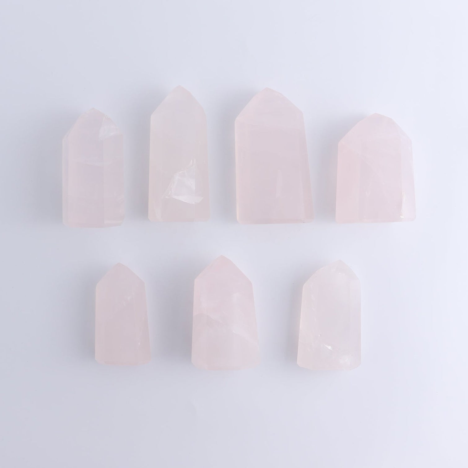 Imperfect Rose Quartz Towers Set of 7 - Expert Wholesale and Supplier of Wholesale Crystals & Bulk Gemstones, ["Brazil","Points","Quartz","Rose Quartz","Towers"]
