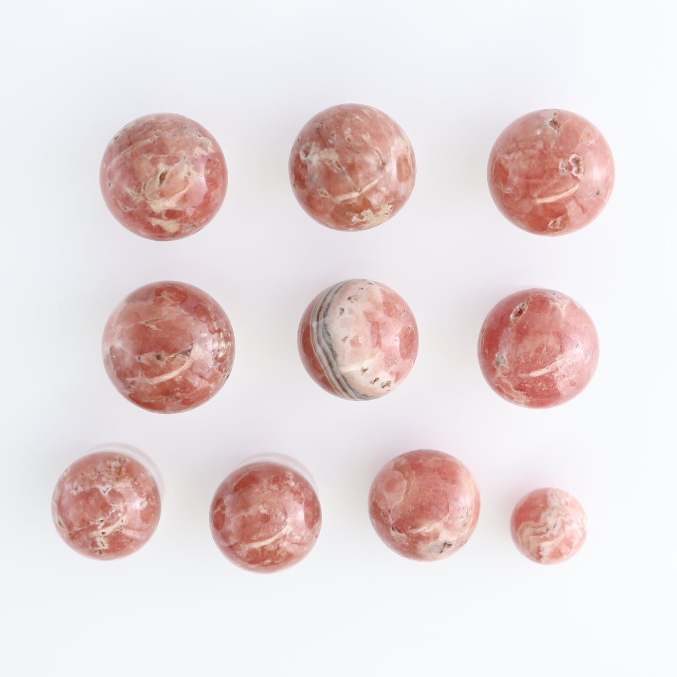 Rhodochrosite Spheres Set of 10 | Mi Esperanza Minerals | Supplier of Crystals and Onyx