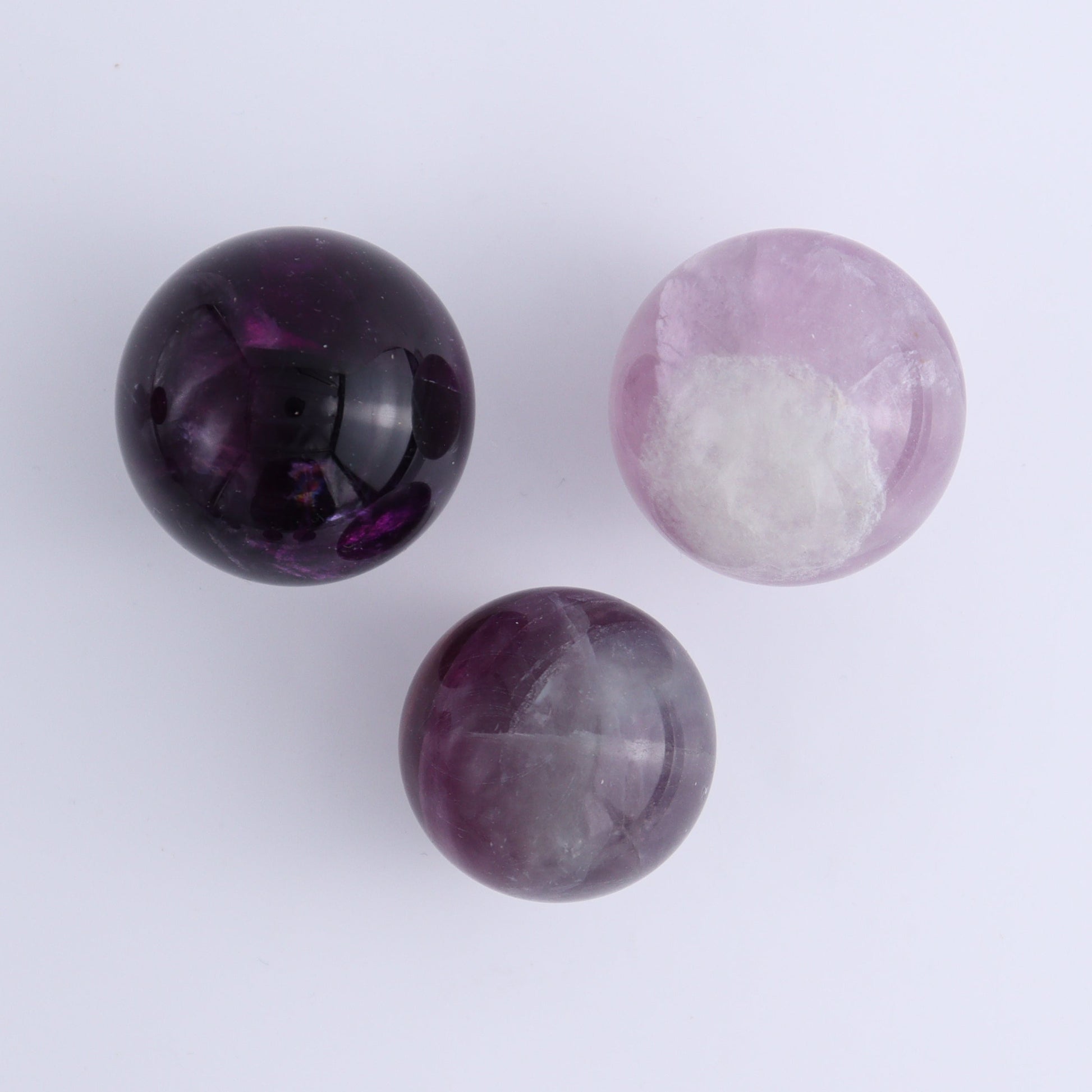 Purple Fluorite Spheres Set of 9 - Expert Wholesale and Supplier of Wholesale Crystals & Bulk Gemstones, ["Fluorite","Purple Fluorite","Spheres"]