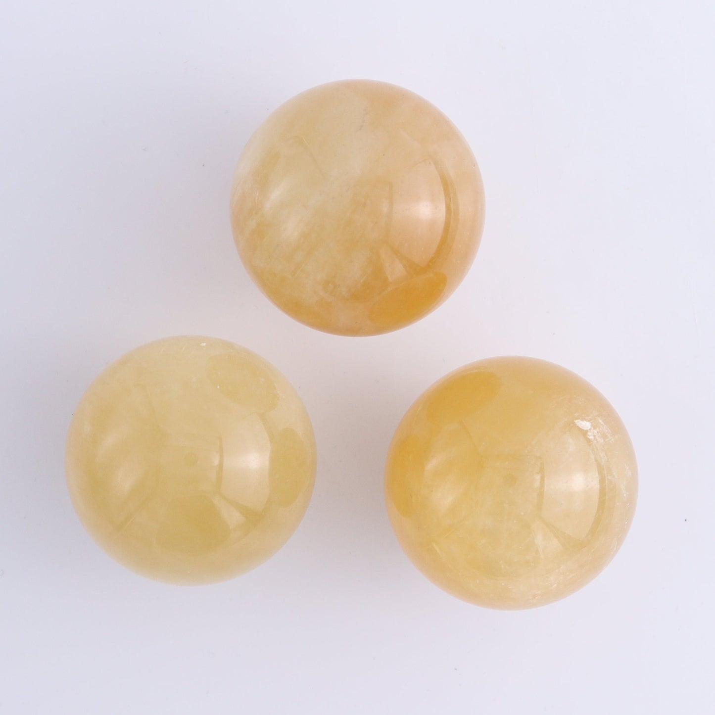 Calcite Spheres Set of 9 - Expert Wholesale and Supplier of Wholesale Crystals & Bulk Gemstones, ["Calcite","Mexico","Spheres"]