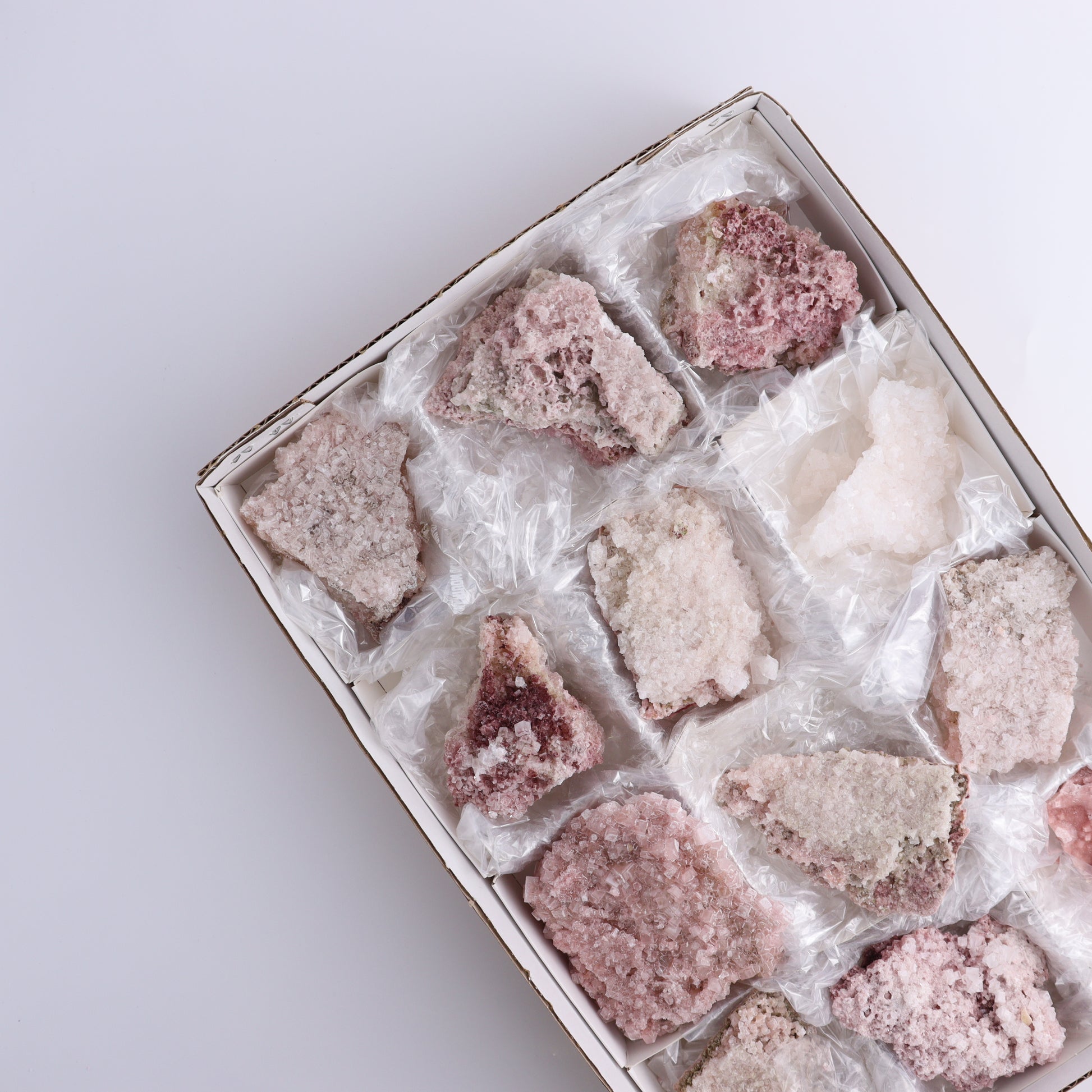 Pink Halite Set of 12 - Expert Wholesale and Supplier of Wholesale Crystals & Bulk Gemstones, ["close_50","Flats","Halite","Pink Halite","United States"]