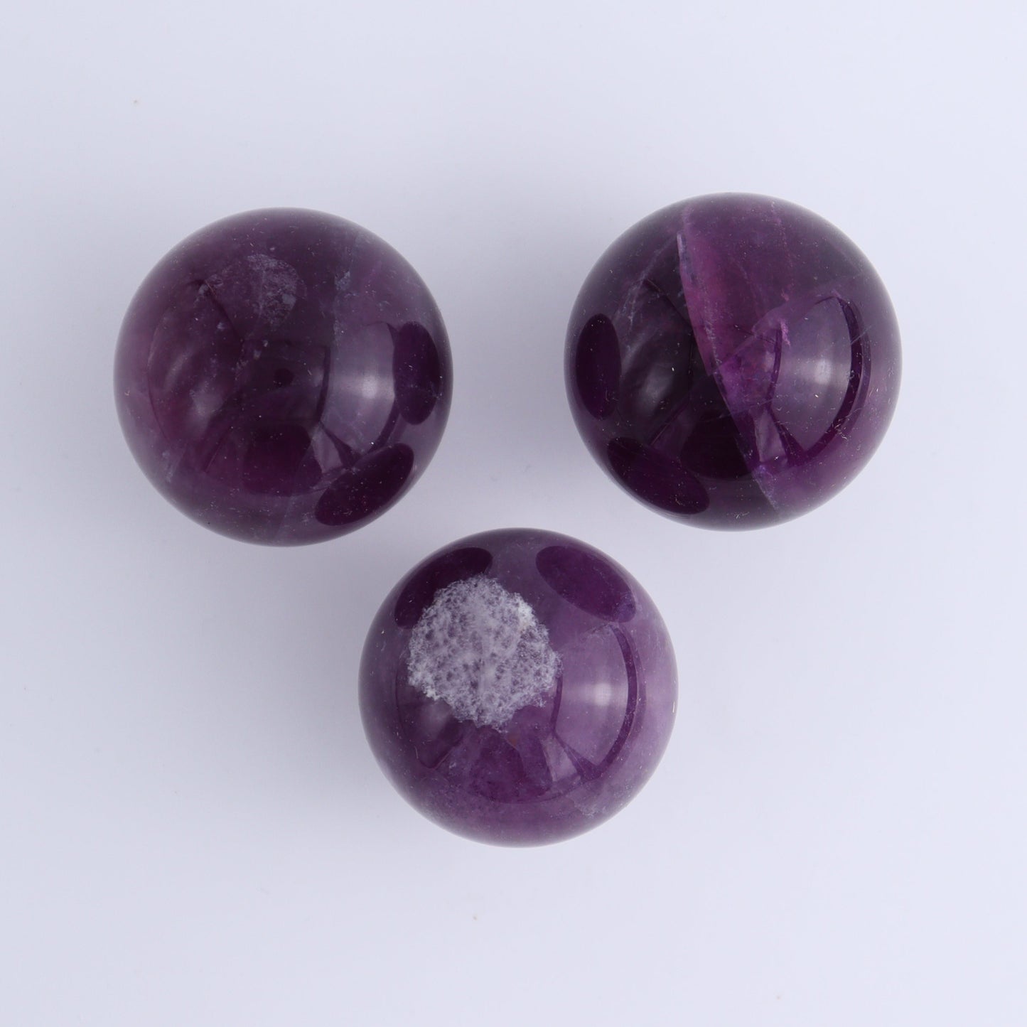 Purple Fluorite Spheres Set of 9 - Expert Wholesale and Supplier of Wholesale Crystals & Bulk Gemstones, ["Fluorite","Purple Fluorite","Spheres"]