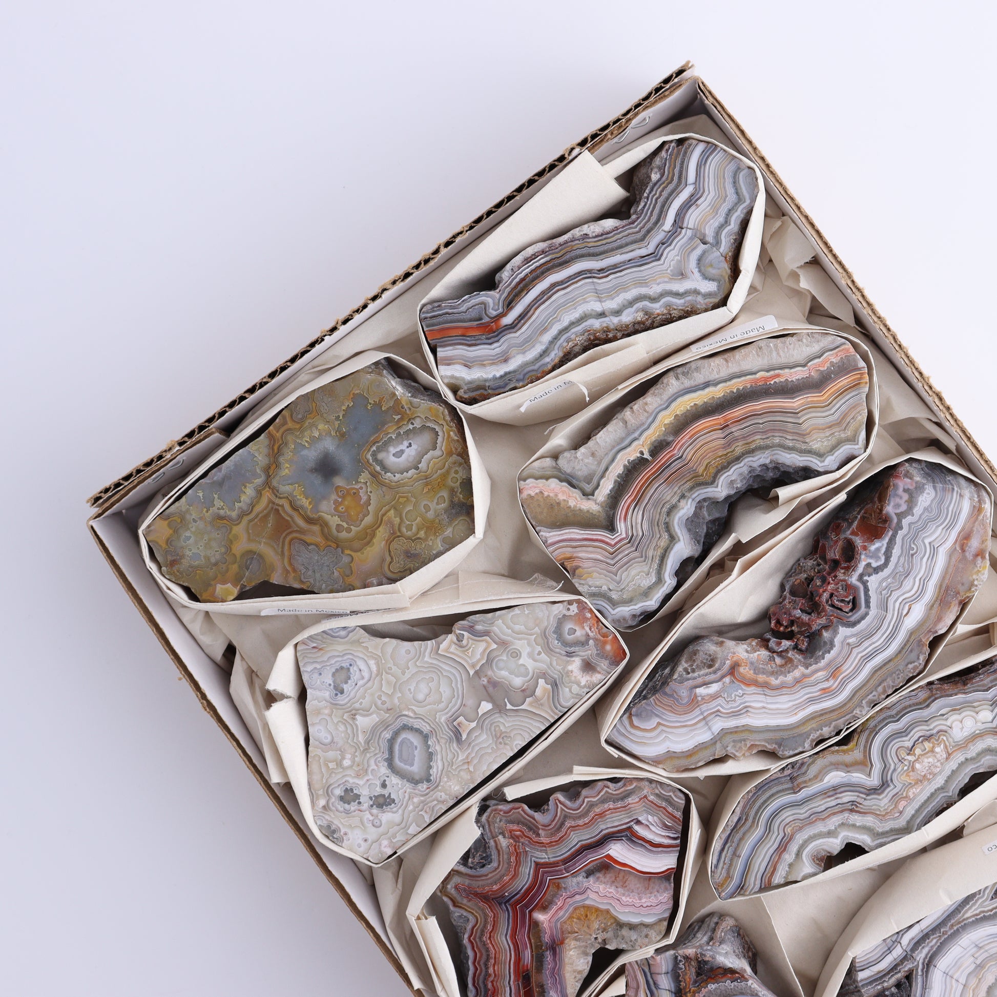 *sold Crazy Lace Agate Flat of 9 - Expert Wholesale and Supplier of Wholesale Crystals & Bulk Gemstones, ["Crazy Lace Agate","Mexico"]