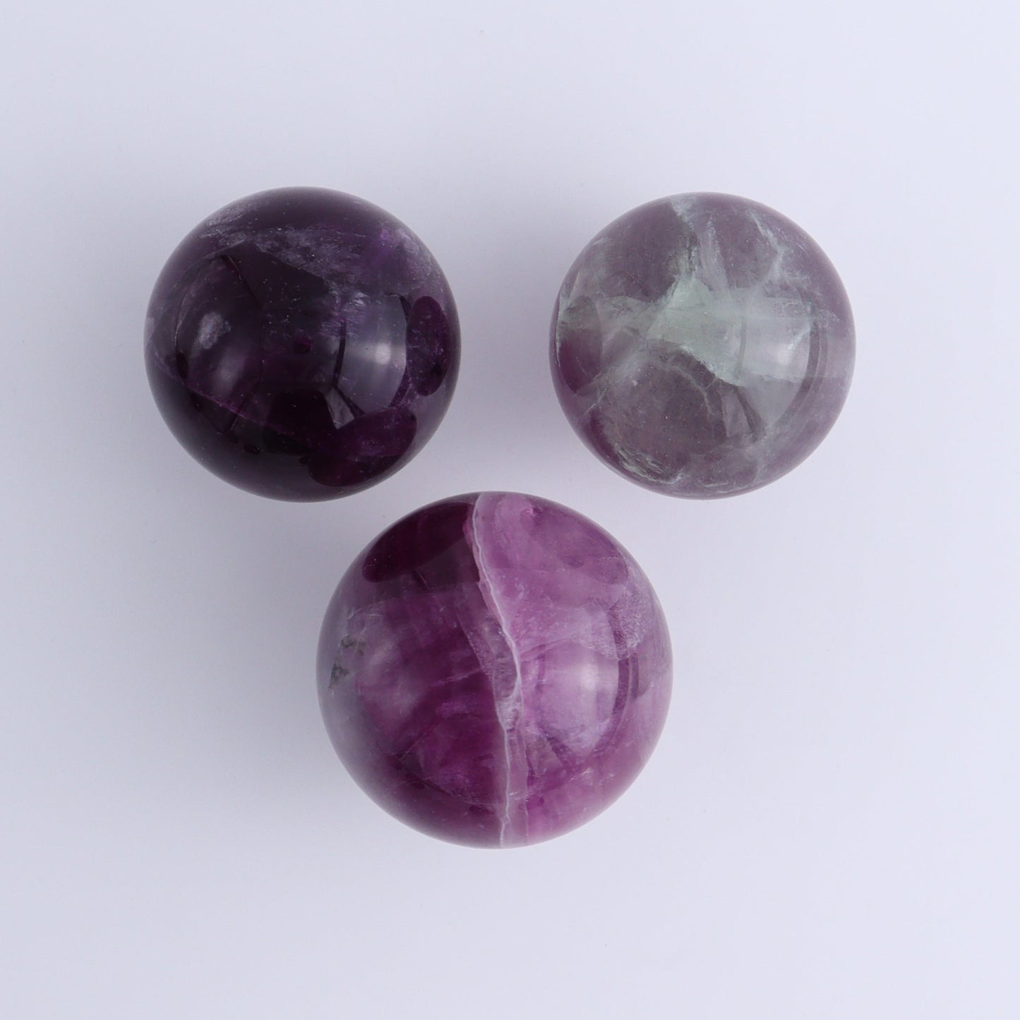 Purple Fluorite Spheres Set of 9 - Expert Wholesale and Supplier of Wholesale Crystals & Bulk Gemstones, ["Fluorite","Purple Fluorite","Spheres"]