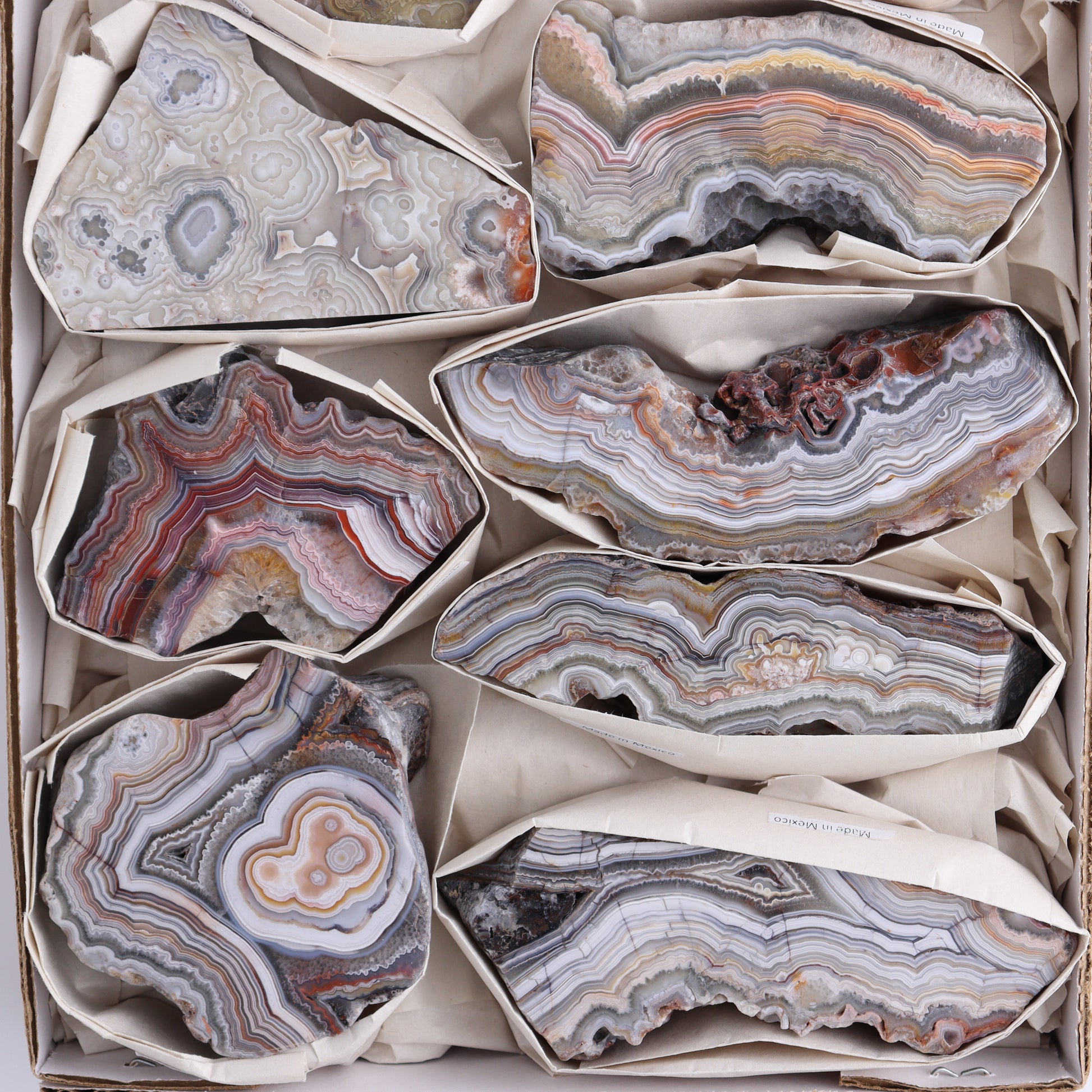 *sold Crazy Lace Agate Flat of 9 - Expert Wholesale and Supplier of Wholesale Crystals & Bulk Gemstones, ["Crazy Lace Agate","Mexico"]