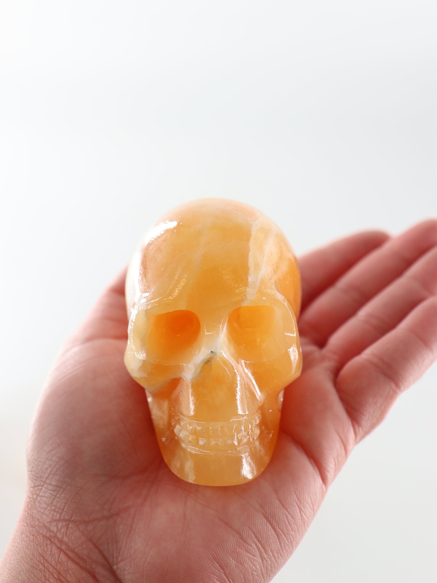 Orange Calcite Skulls Set of 4 - Expert Wholesale and Supplier of Wholesale Crystals & Bulk Gemstones, ["Calcite","Orange Calcite","Skulls"]