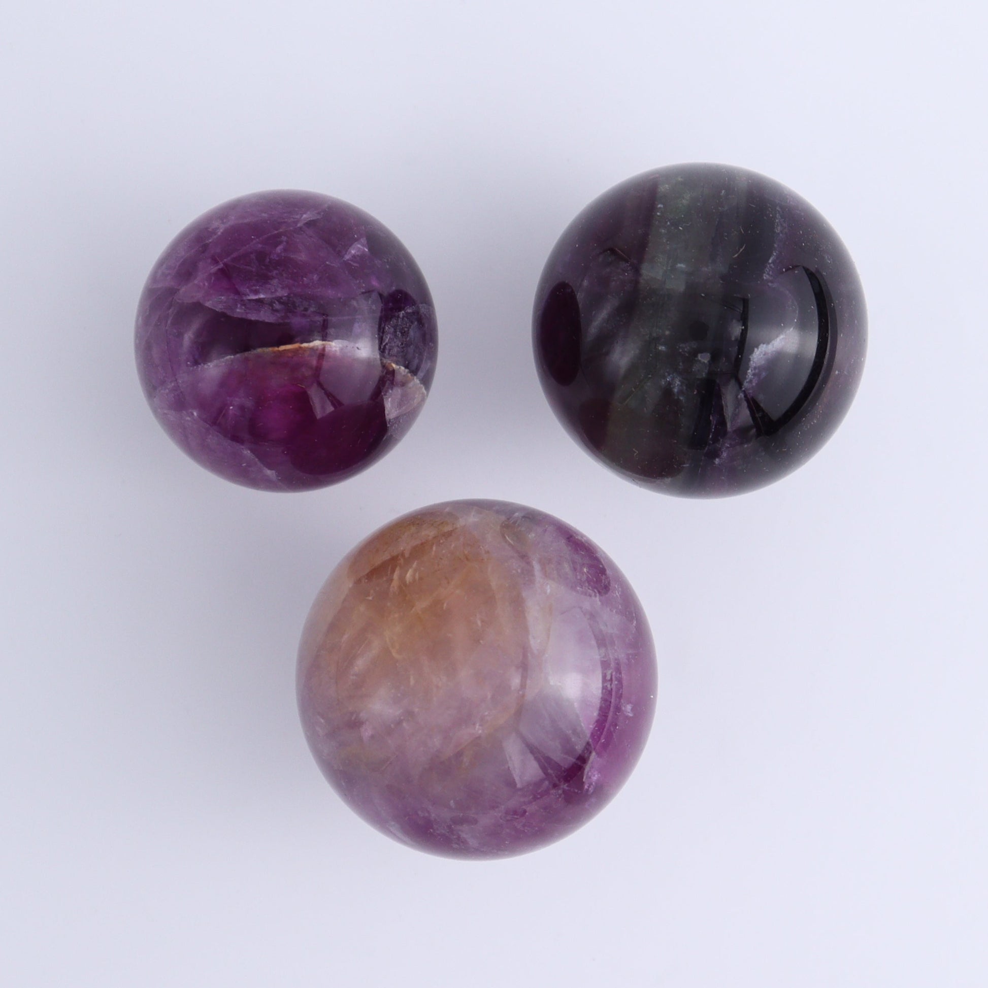 Purple Fluorite Spheres Set of 9 - Expert Wholesale and Supplier of Wholesale Crystals & Bulk Gemstones, ["Fluorite","Purple Fluorite","Spheres"]