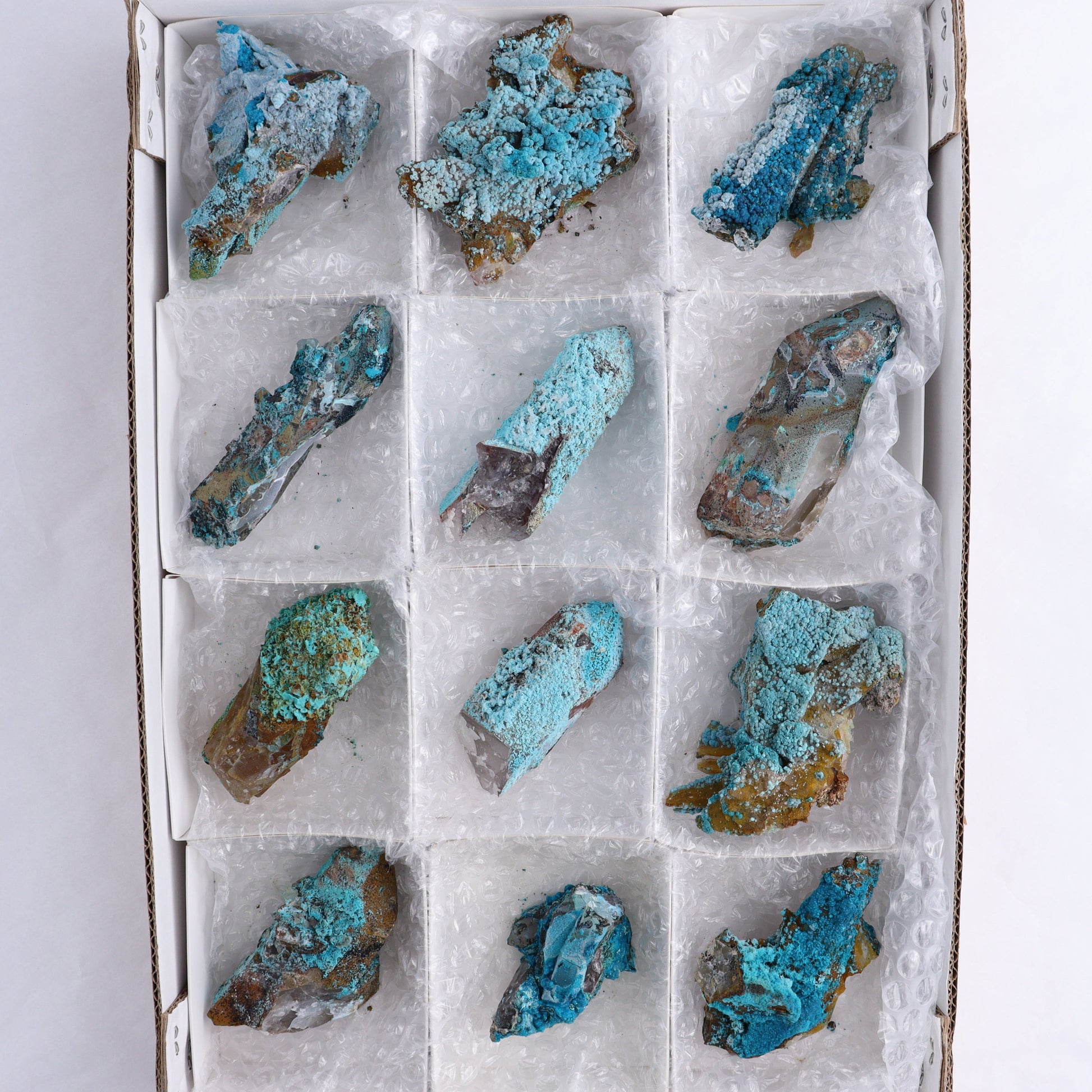 Chrysocolla on Quartz Roughs Set of 12 - Expert Wholesale and Supplier of Wholesale Crystals & Bulk Gemstones, ["Chrysocolla","Flats","Freeforms","Peru","Quartz","Rough"]