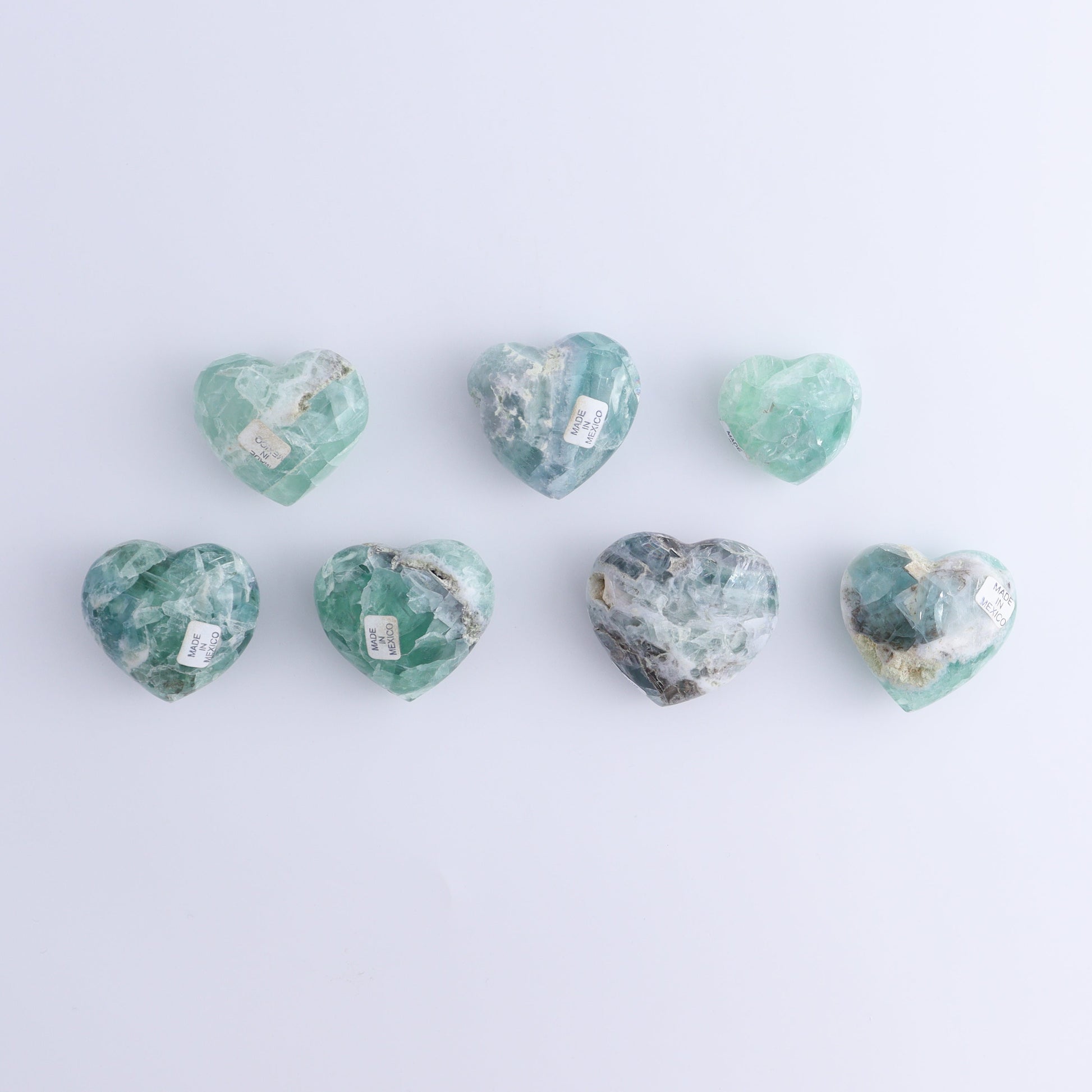 Fluorite Hearts Set of 7 - Expert Wholesale and Supplier of Wholesale Crystals & Bulk Gemstones, ["Fluorite","Hearts","Mexico"]