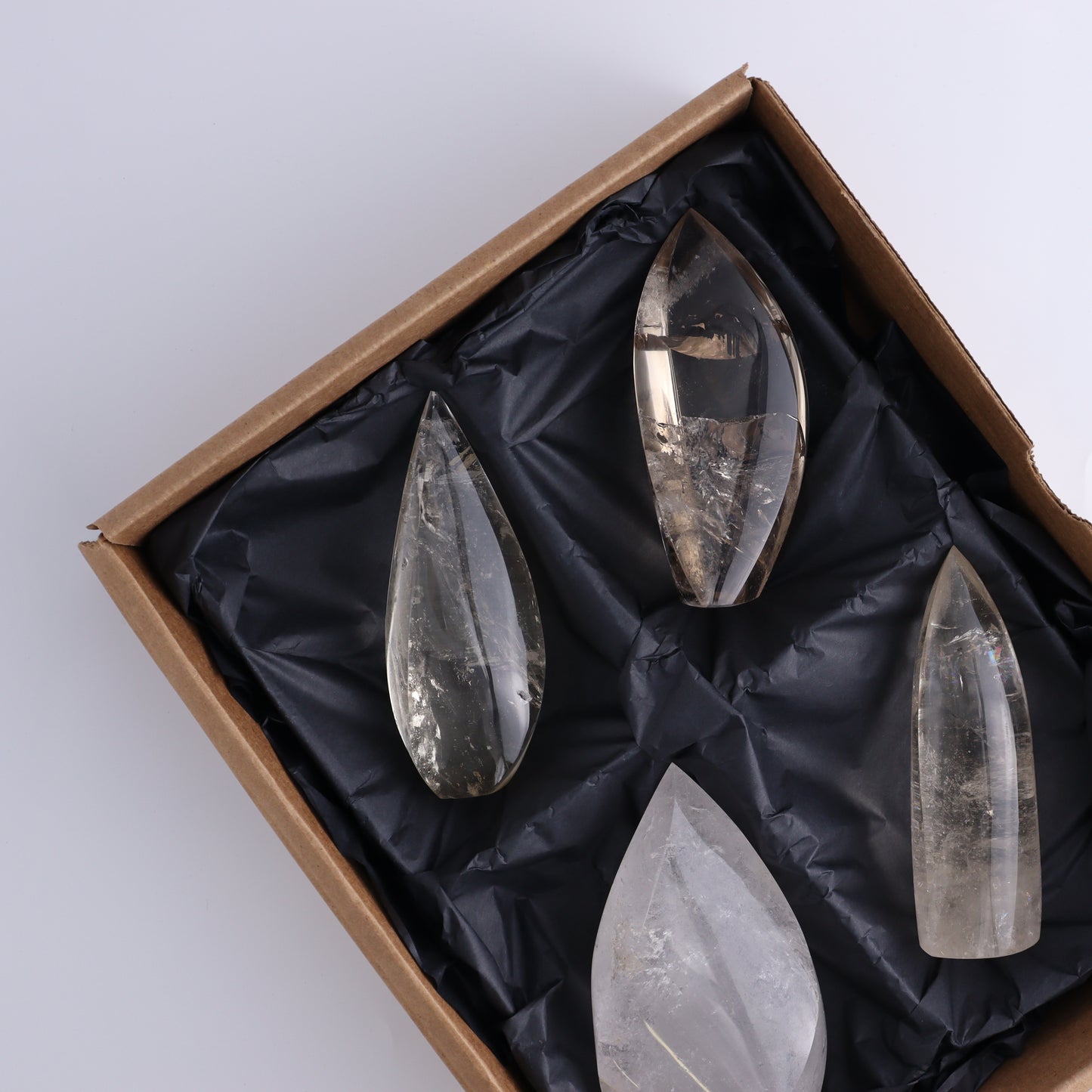 Imperfect Clear and Smoky Quartz Flames Set of 4 - Expert Wholesale and Supplier of Wholesale Crystals & Bulk Gemstones, ["Brazil","Clear Quartz","flames","Quartz","Smoky Quartz"]
