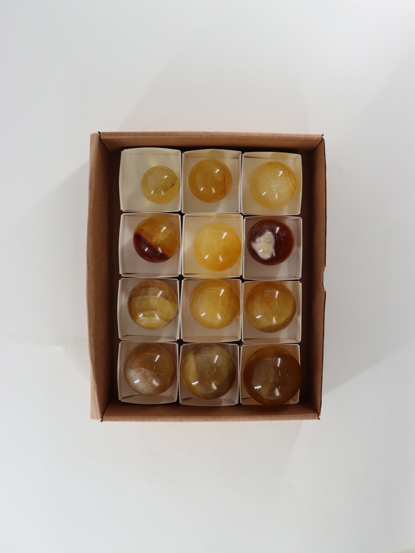 Fluorite Spheres Set of 12 - Expert Wholesale and Supplier of Wholesale Crystals & Bulk Gemstones, []