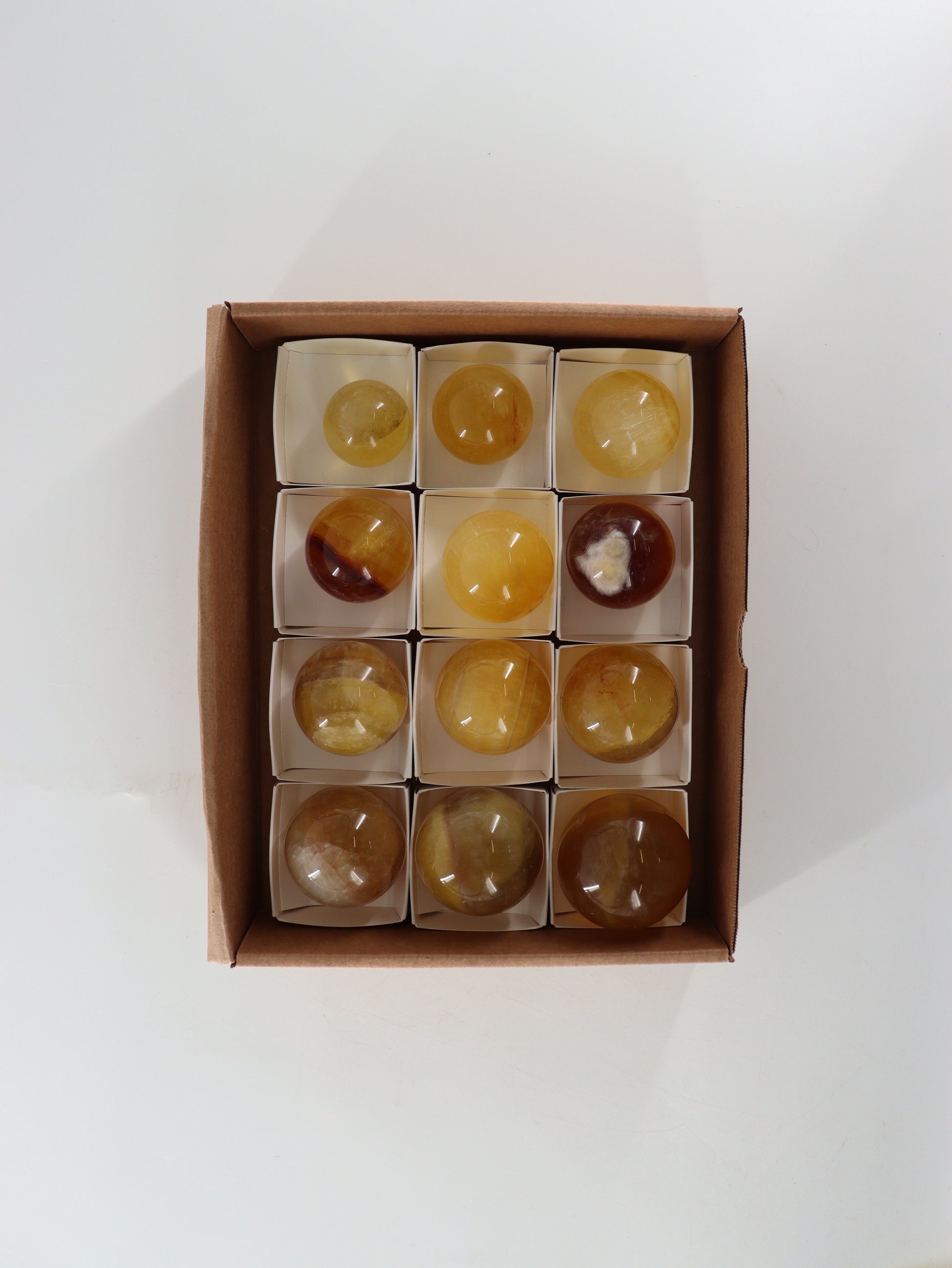 Fluorite Spheres Set of 12 - Expert Wholesale and Supplier of Wholesale Crystals & Bulk Gemstones, []