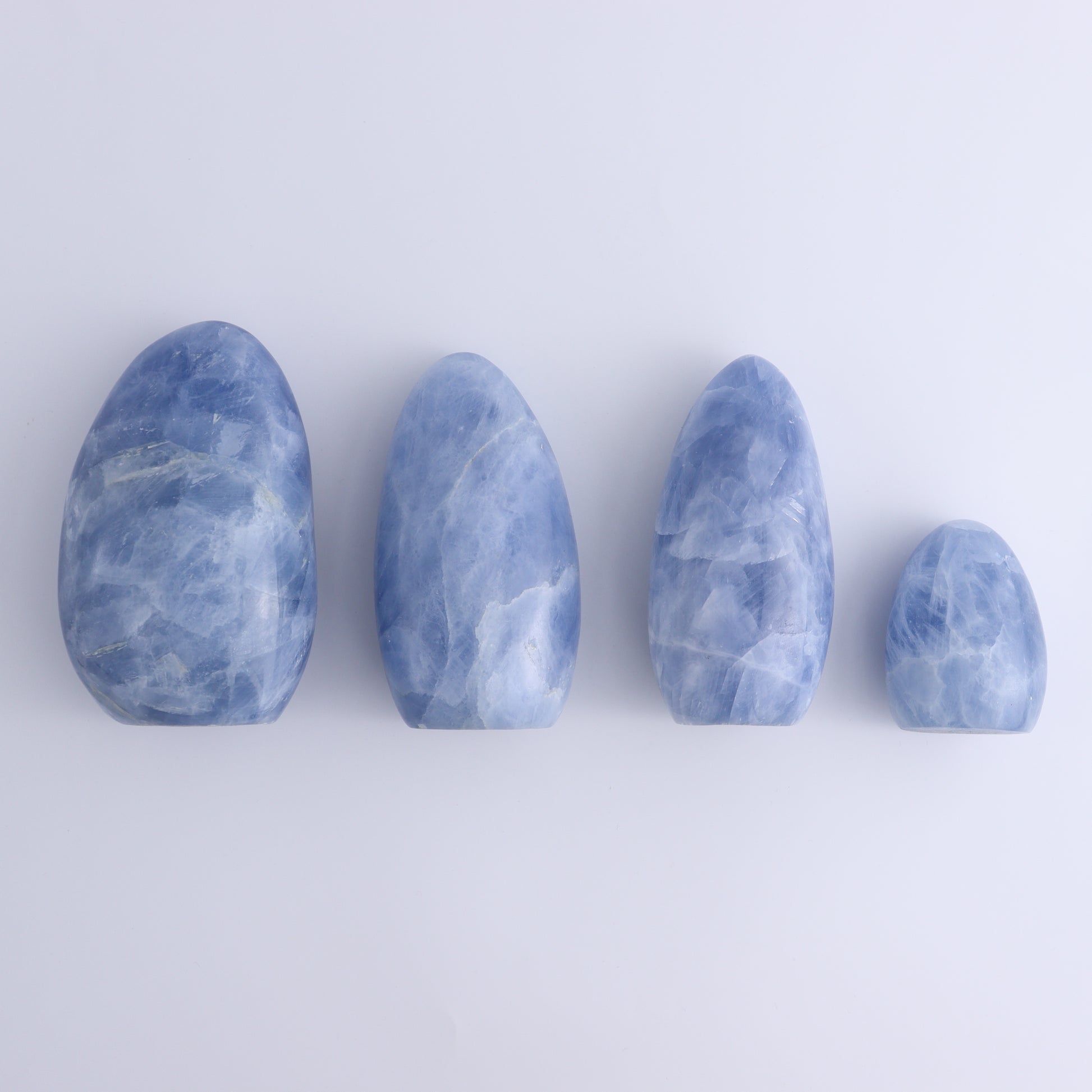 Blue Calcite Freeforms Set of 4 - Expert Wholesale and Supplier of Wholesale Crystals & Bulk Gemstones, ["Blue Calcite","Calcite","close_30","Freeform","Freeforms"]