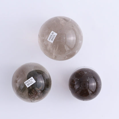 Smoky Quartz Spheres Set of 9 - Expert Wholesale and Supplier of Wholesale Crystals & Bulk Gemstones, ["Quartz","Smoky Quartz","Spheres"]