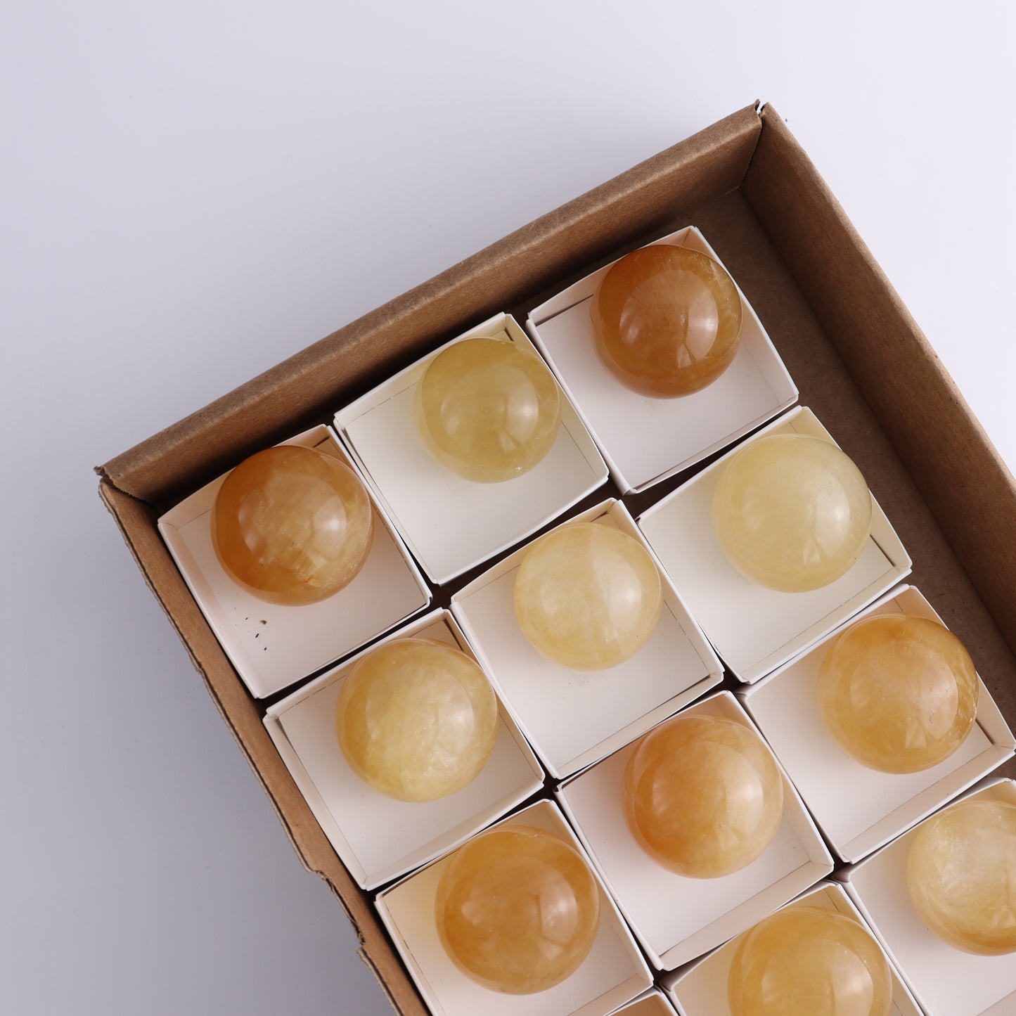 Honey Calcite Spheres Set of 12 - Expert Wholesale and Supplier of Wholesale Crystals & Bulk Gemstones, ["Calcite","Honey Calcite","Mexico","Spheres"]