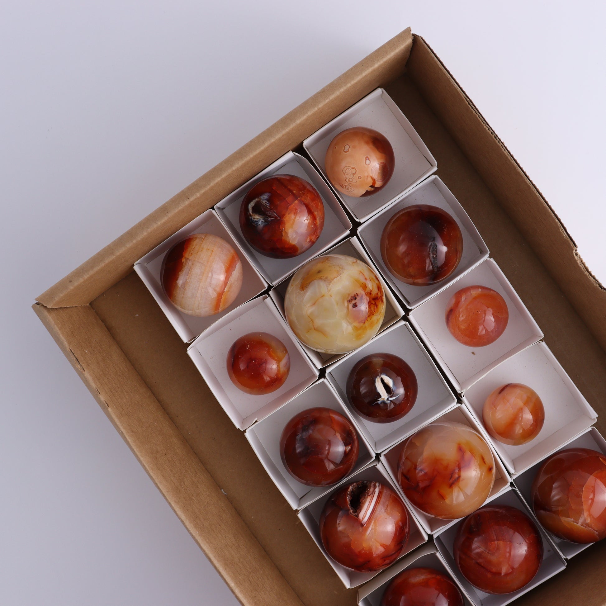 Carnelian Spheres Set of 15 - Expert Wholesale and Supplier of Wholesale Crystals & Bulk Gemstones, ["carnelian","close_30","flames","Madagascar"]