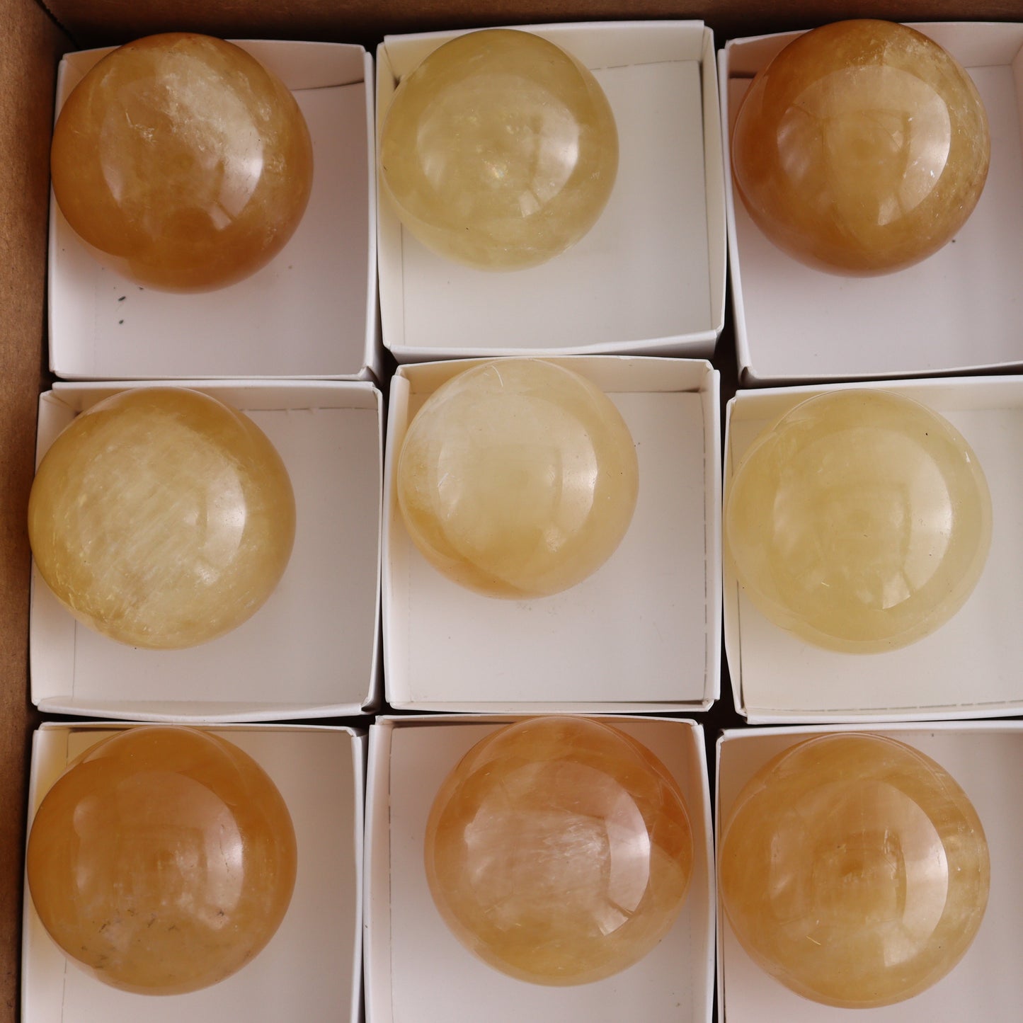 Honey Calcite Spheres Set of 12 - Expert Wholesale and Supplier of Wholesale Crystals & Bulk Gemstones, ["Calcite","Honey Calcite","Mexico","Spheres"]