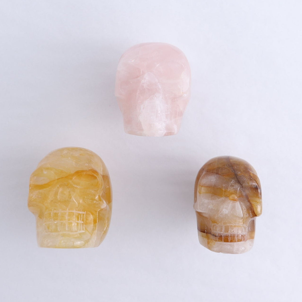 Golden Healer Skulls Set of 2 & 1 Rose Quartz Skull