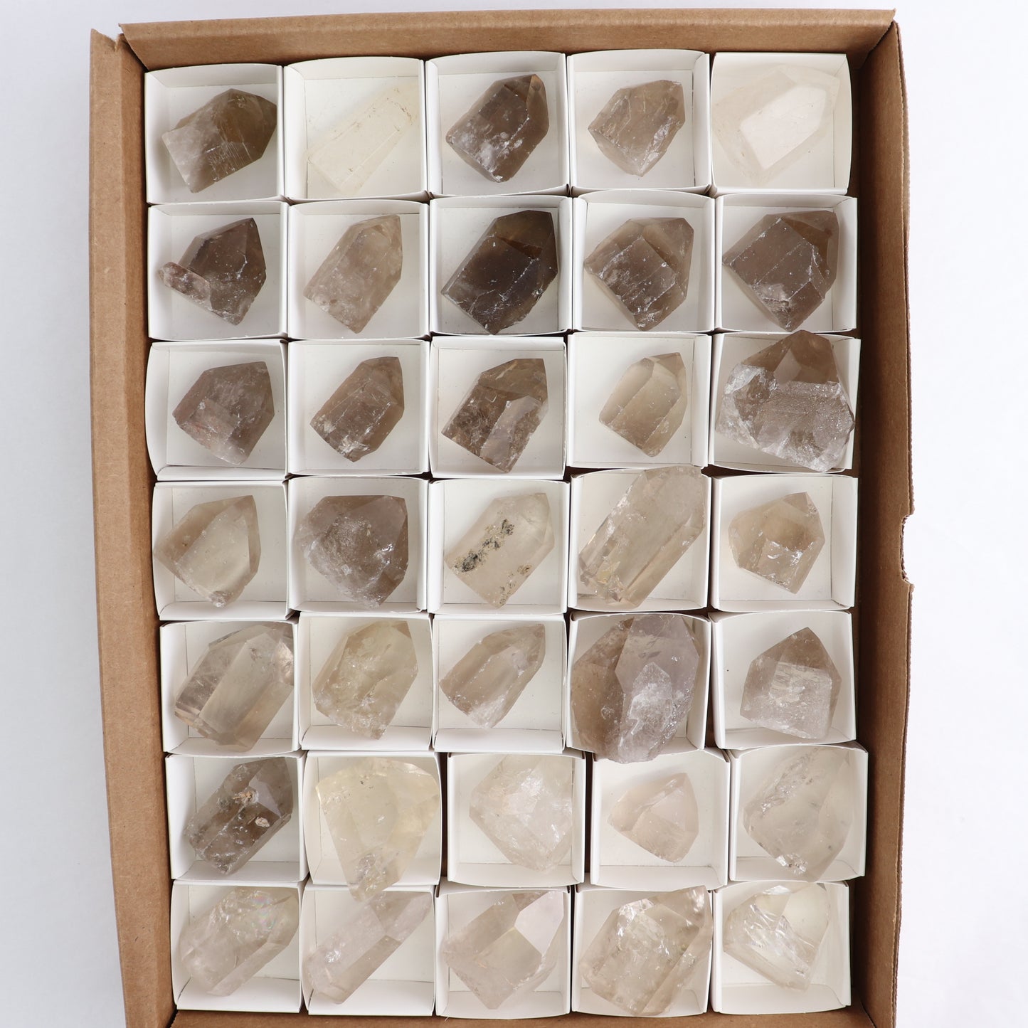 Smoky Quartz Polished Tops Set of 35 - Expert Wholesale and Supplier of Wholesale Crystals & Bulk Gemstones, ["Brazil","Points","Polished Tip","Quartz","Smoky Quartz"]