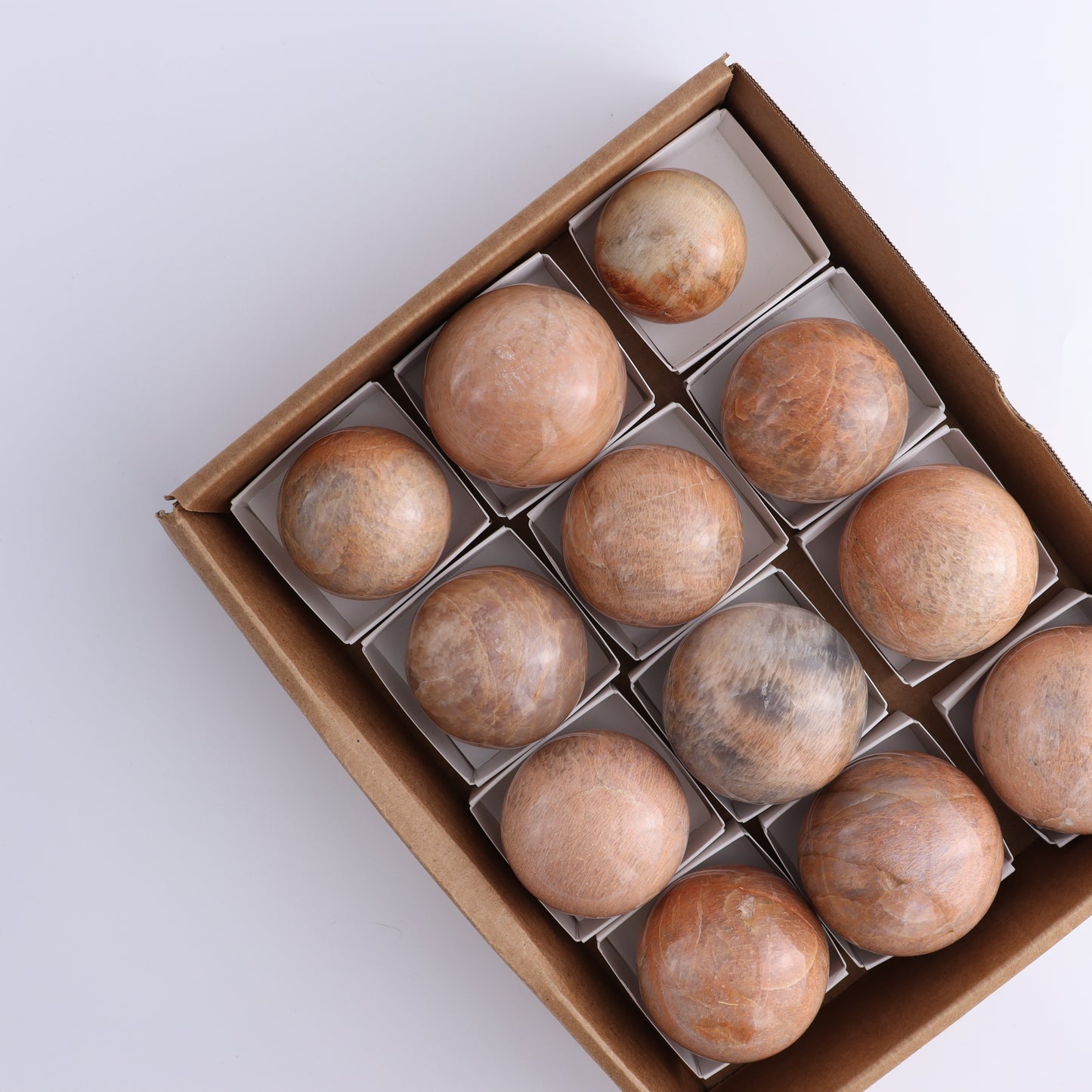 Peach Moonstone Spheres Set of 12 - Expert Wholesale and Supplier of Wholesale Crystals & Bulk Gemstones, ["close_50","Freeforms","Peach Moonstone"]