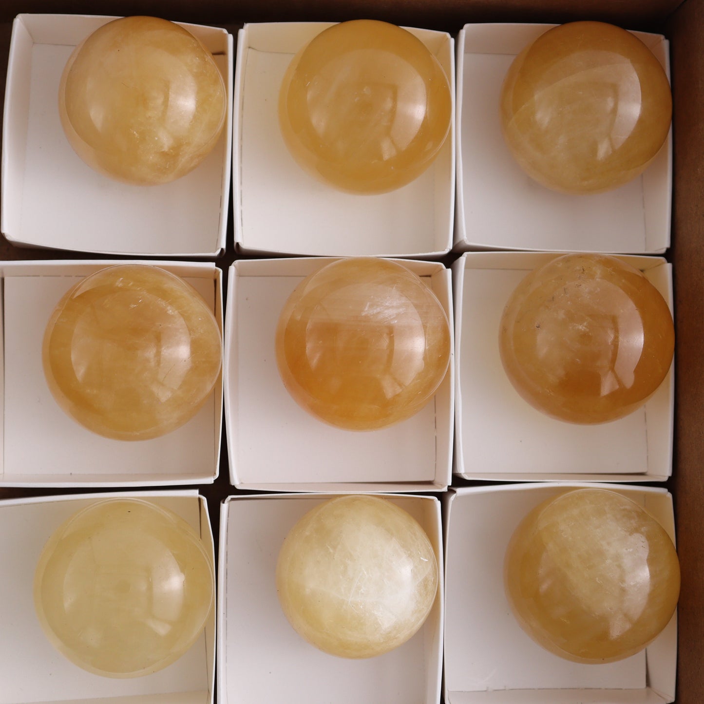 Honey Calcite Spheres Set of 12 - Expert Wholesale and Supplier of Wholesale Crystals & Bulk Gemstones, ["Calcite","Honey Calcite","Mexico","Spheres"]