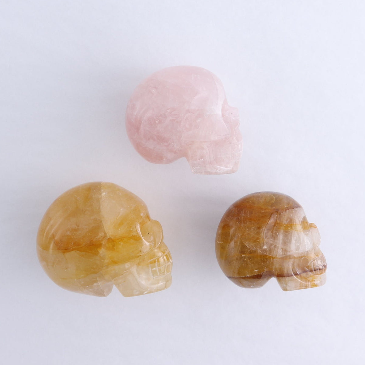 Golden Healer Skulls Set of 2 & 1 Rose Quartz Skull