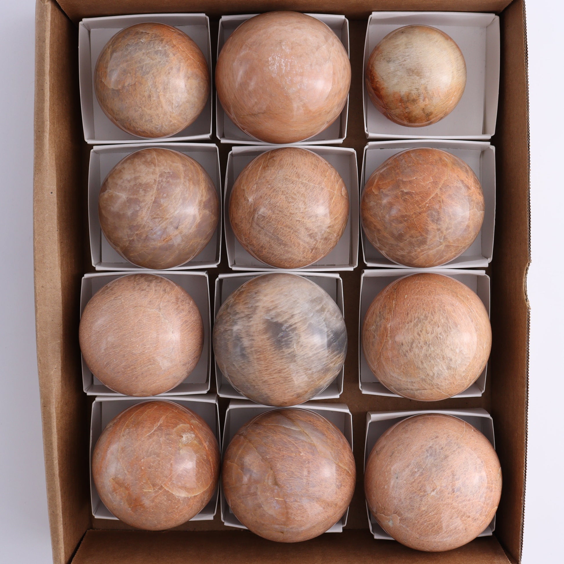 Peach Moonstone Spheres Set of 12 - Expert Wholesale and Supplier of Wholesale Crystals & Bulk Gemstones, ["close_50","Freeforms","Peach Moonstone"]