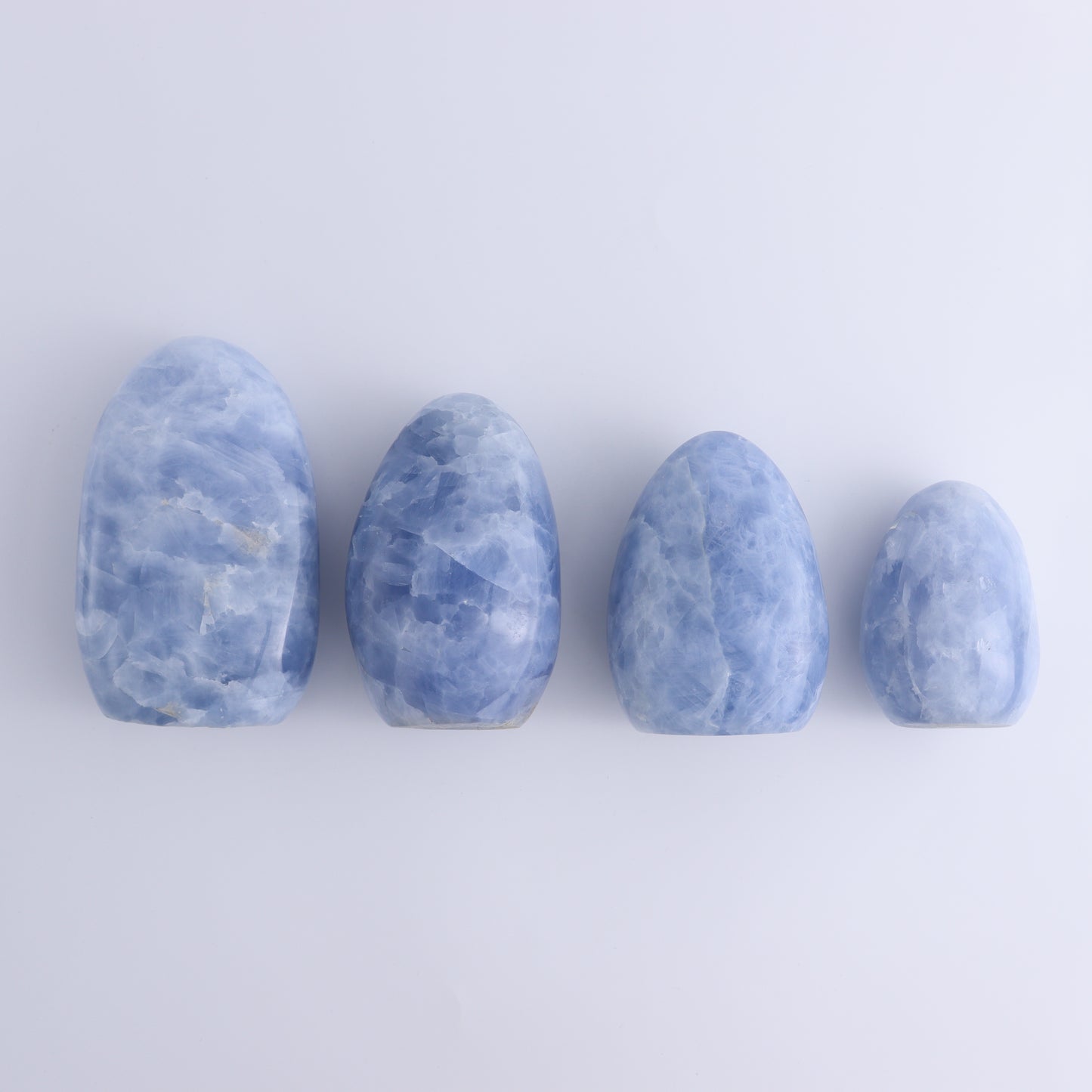 Blue Calcite Freeforms Set of 4 - Expert Wholesale and Supplier of Wholesale Crystals & Bulk Gemstones, ["Blue Calcite","Calcite","close_30","Freeform","Freeforms"]