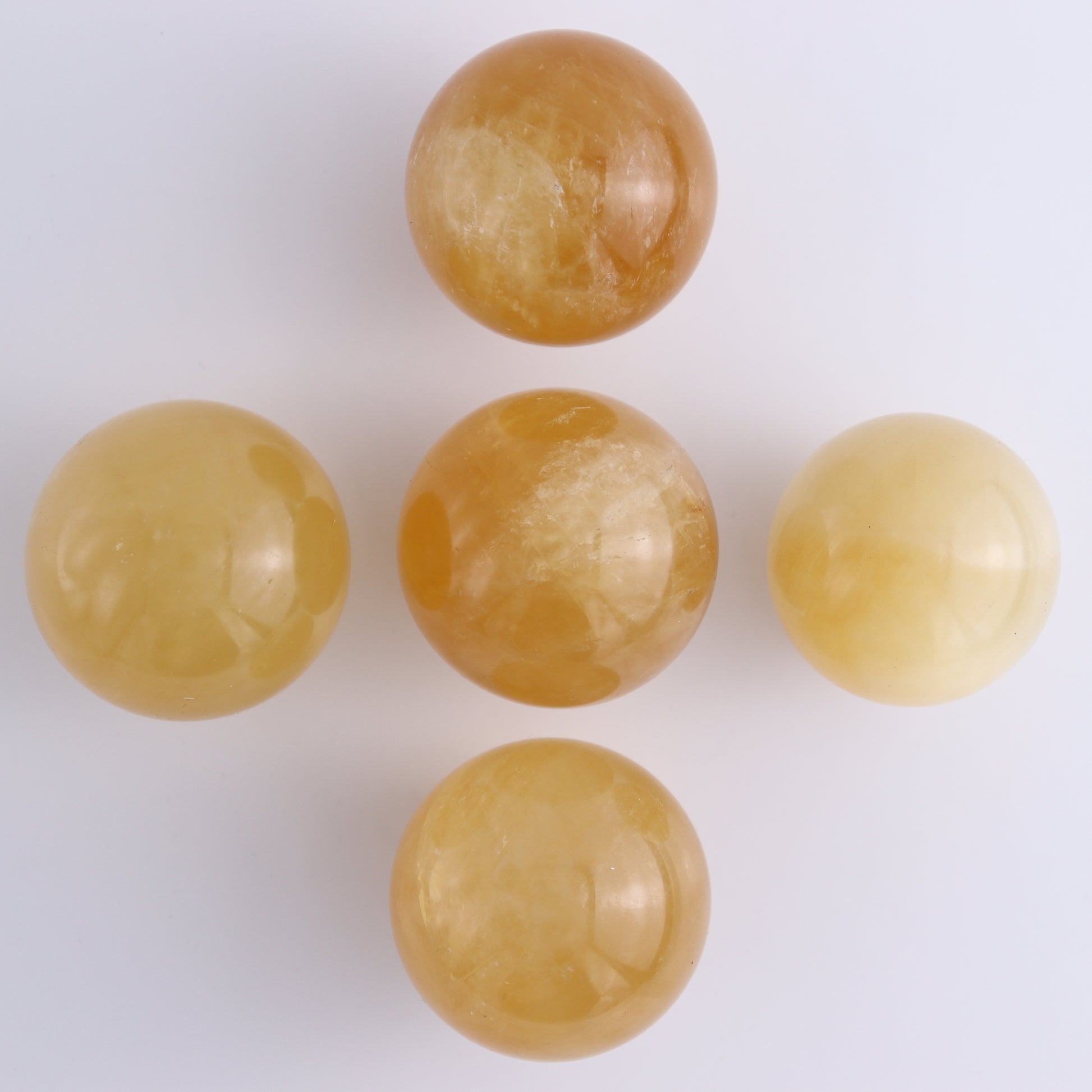 Honey Calcite Spheres Set of 12 - Expert Wholesale and Supplier of Wholesale Crystals & Bulk Gemstones, ["Calcite","Honey Calcite","Mexico","Spheres"]