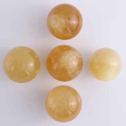 Honey Calcite Spheres Set of 12 - Expert Wholesale and Supplier of Wholesale Crystals & Bulk Gemstones, ["Calcite","Honey Calcite","Mexico","Spheres"]