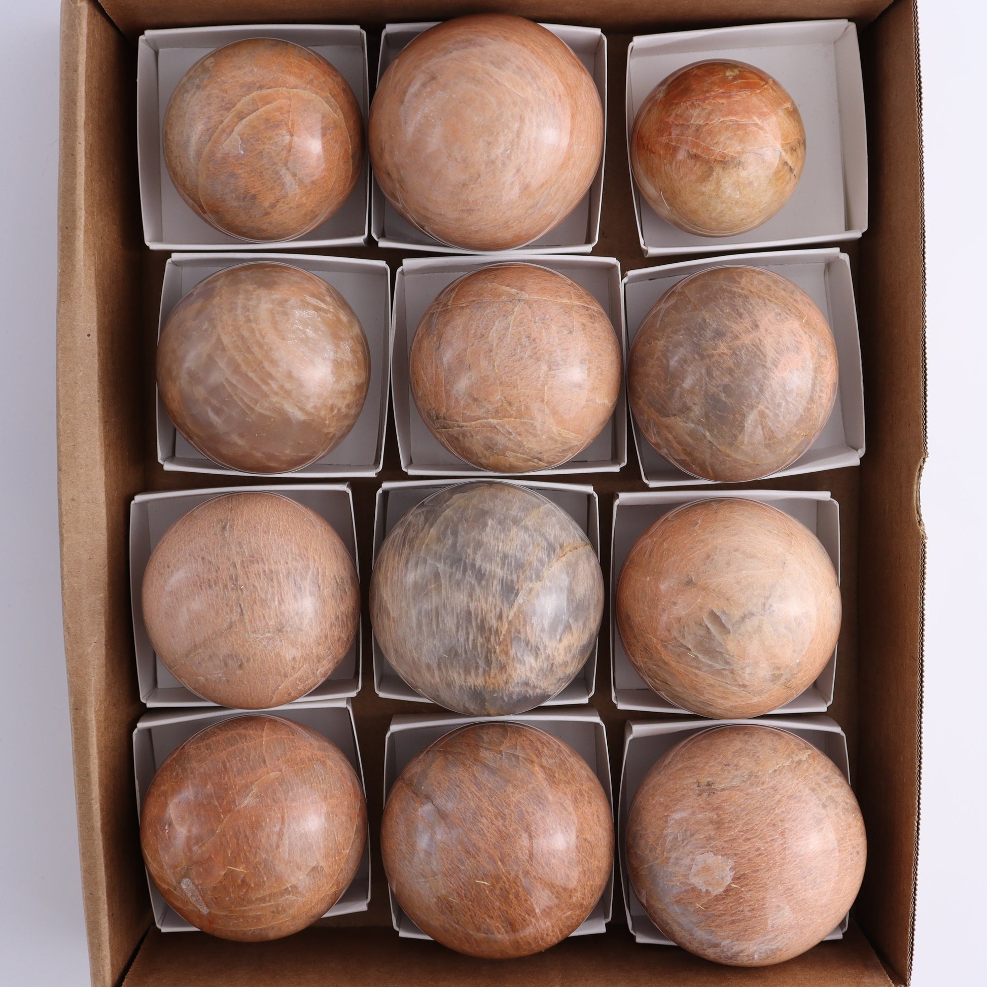 Peach Moonstone Spheres Set of 12 - Expert Wholesale and Supplier of Wholesale Crystals & Bulk Gemstones, ["close_50","Freeforms","Peach Moonstone"]